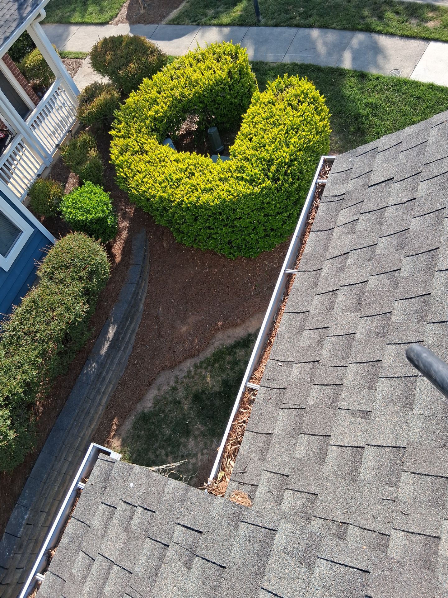 Commercial gutter cleaning Huntersville & Cornelius, NC before photo with filled gutters