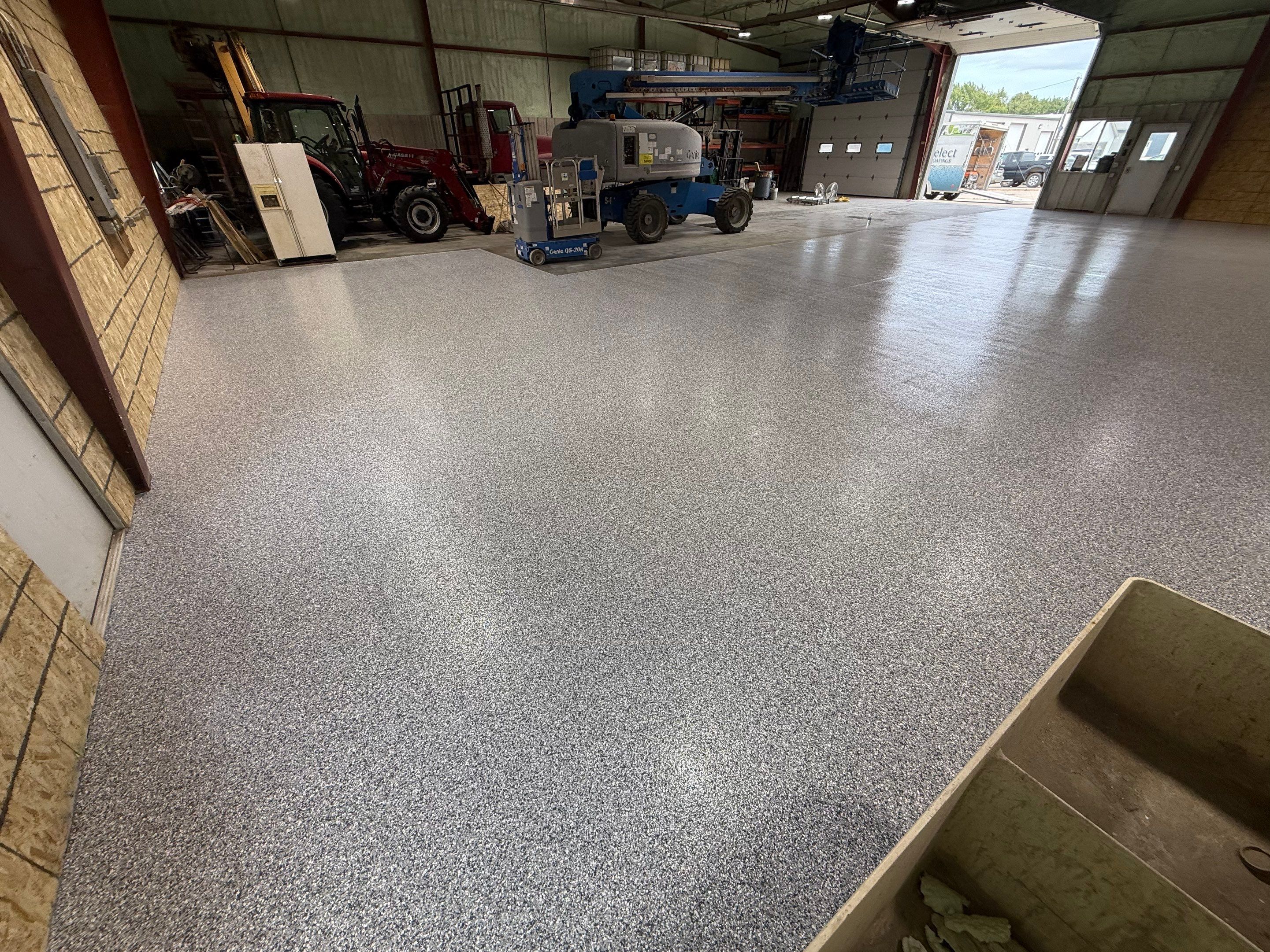 Custom Polyurea Shop Floor with Basketball Court Lines in Rock Valley by Select Painting, Coatings & Garage Cabinets