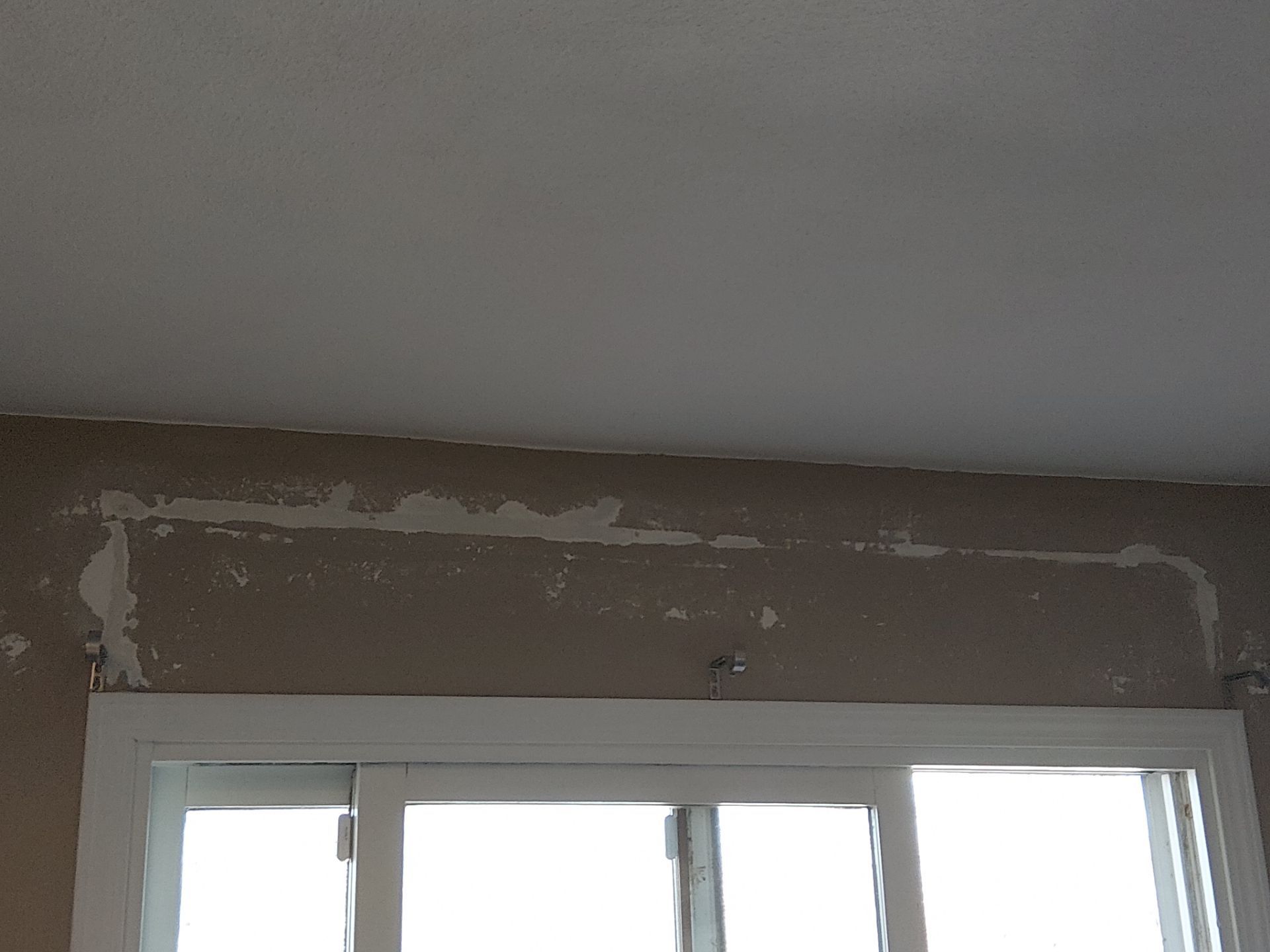 Drywall Repair Above Sliding Door + Seam Repair - Columbia, IL by Legendary Services Company LLC.