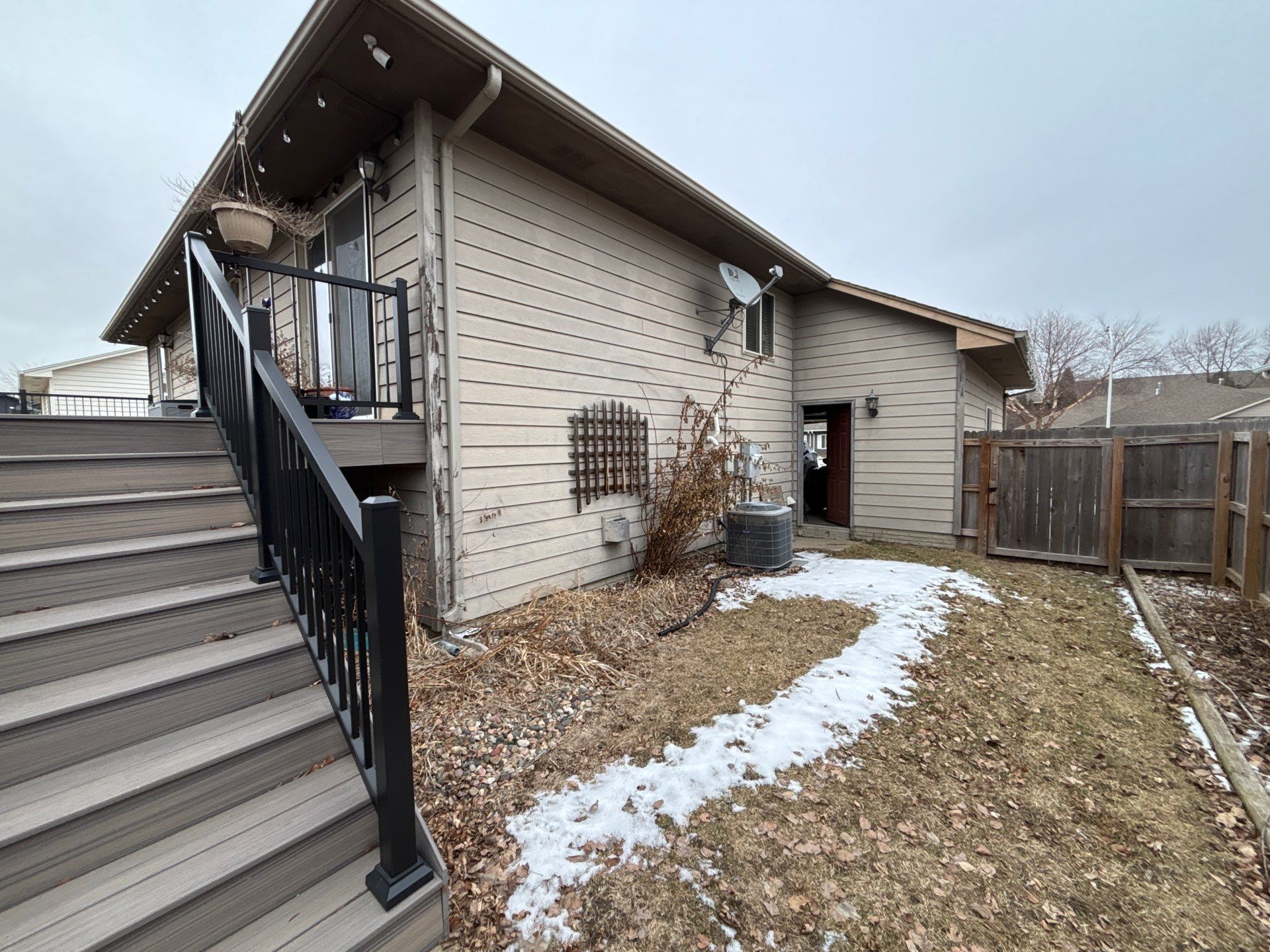 Exterior Painting and Wood Trim Replacement in Sioux Falls by Select Painting, Coatings & Garage Cabinets