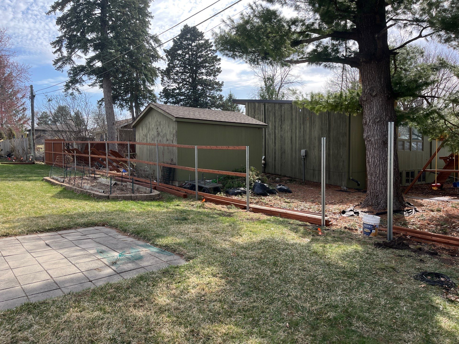 Stained Cedar Wood Privacy Fence Installation in Cedar Falls by Perfect Picket Fence and Stain