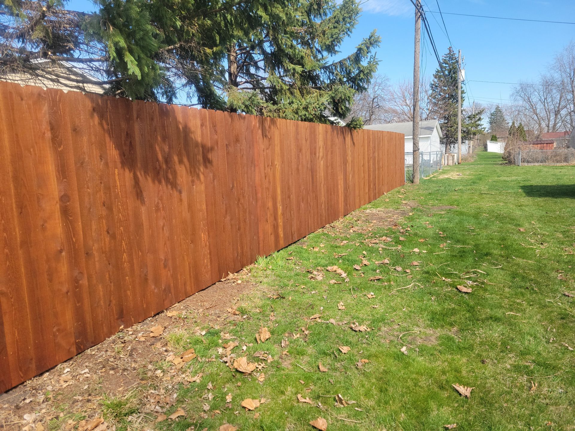 Custom Chestnut Stained Cedar Privacy Fence in Waterloo by Perfect Picket Fence and Stain