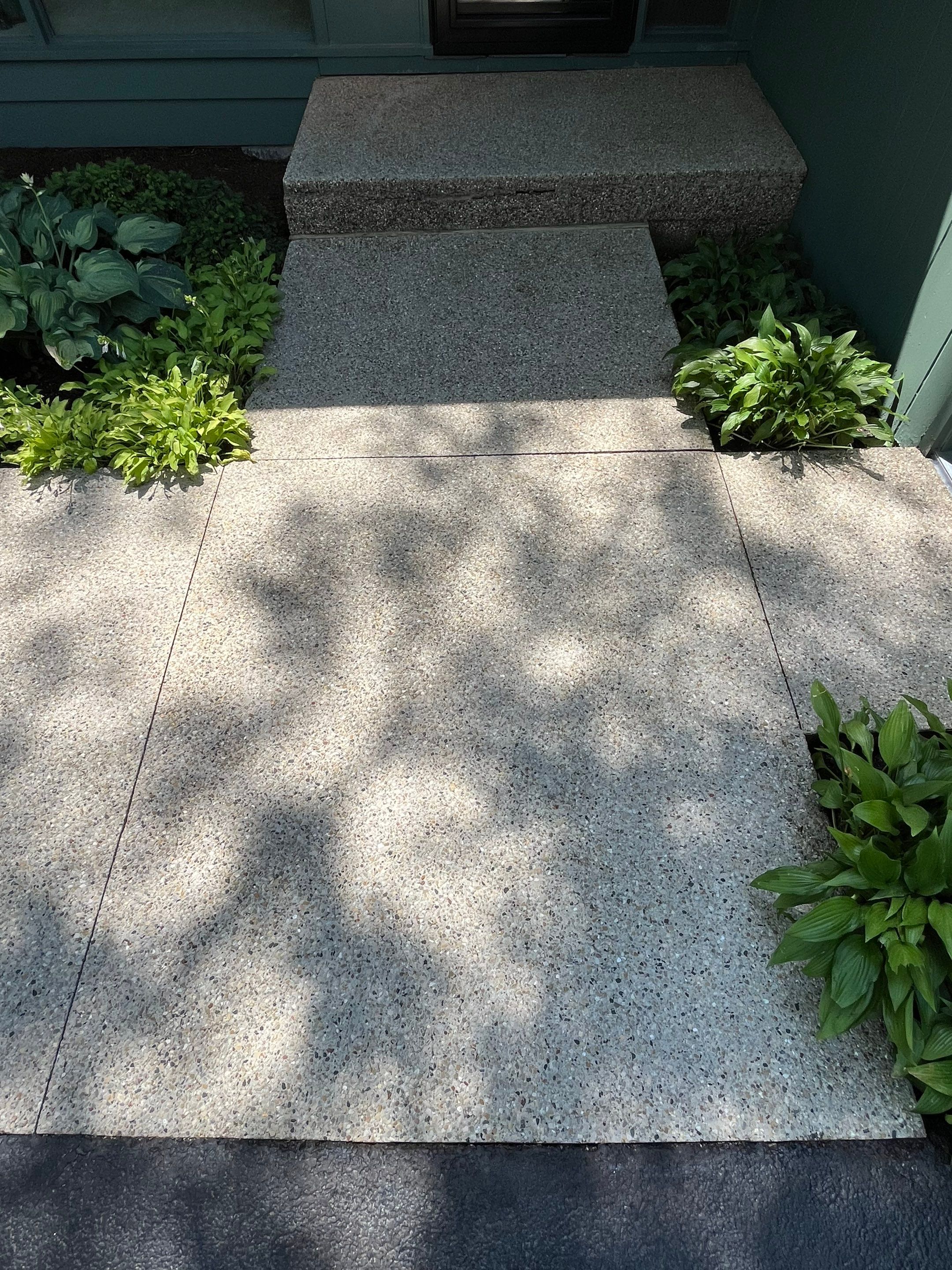 Aggregate concrete cleaning and sealing using Surebond SB-9000 by Northern Power Washing LLC.
