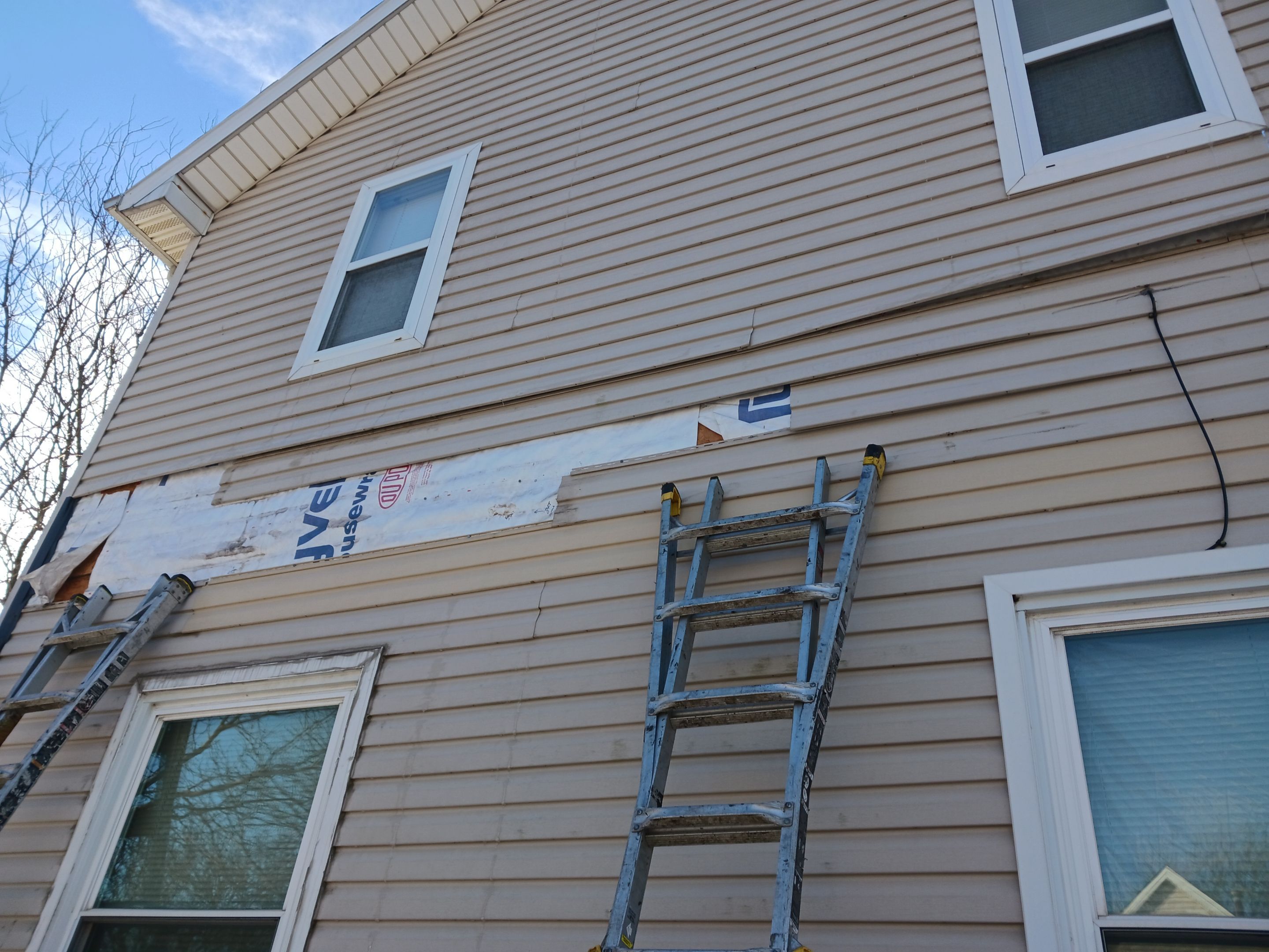 Wind damage to Siding: Insurance paid for full replacement of all siding by Absolute Roofing and Construction