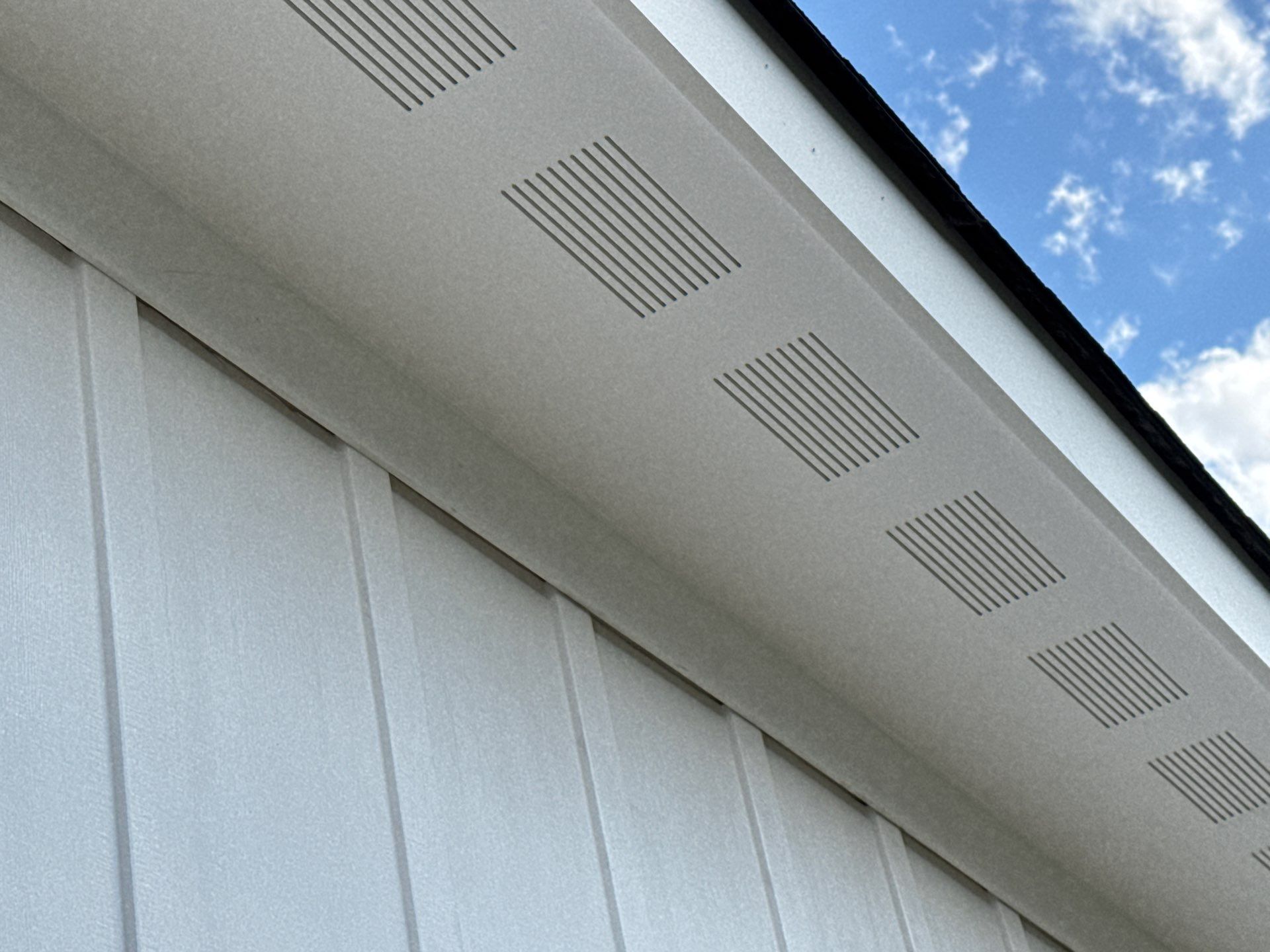 Two-Story Custom Home With Board and Batten Siding by Cade Construction