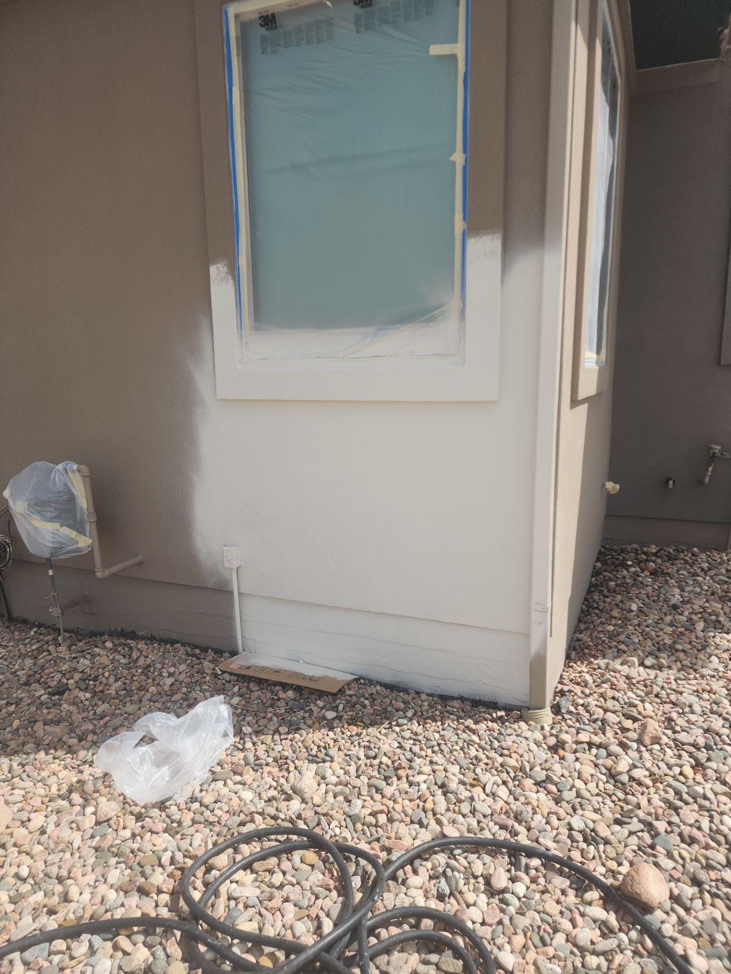 Castle Rock Elegance: White Stucco Exterior with Bold Tricorn Black by J&M Painting LLC