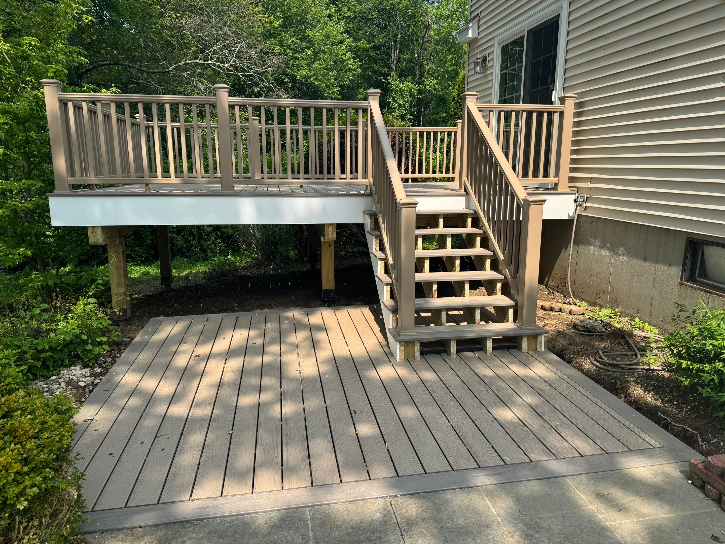 Deck replacement using Trex Transcend Rope Swing and Matching Rope Swing Transcend railing by DiGiorgi Roofing and Siding Inc
