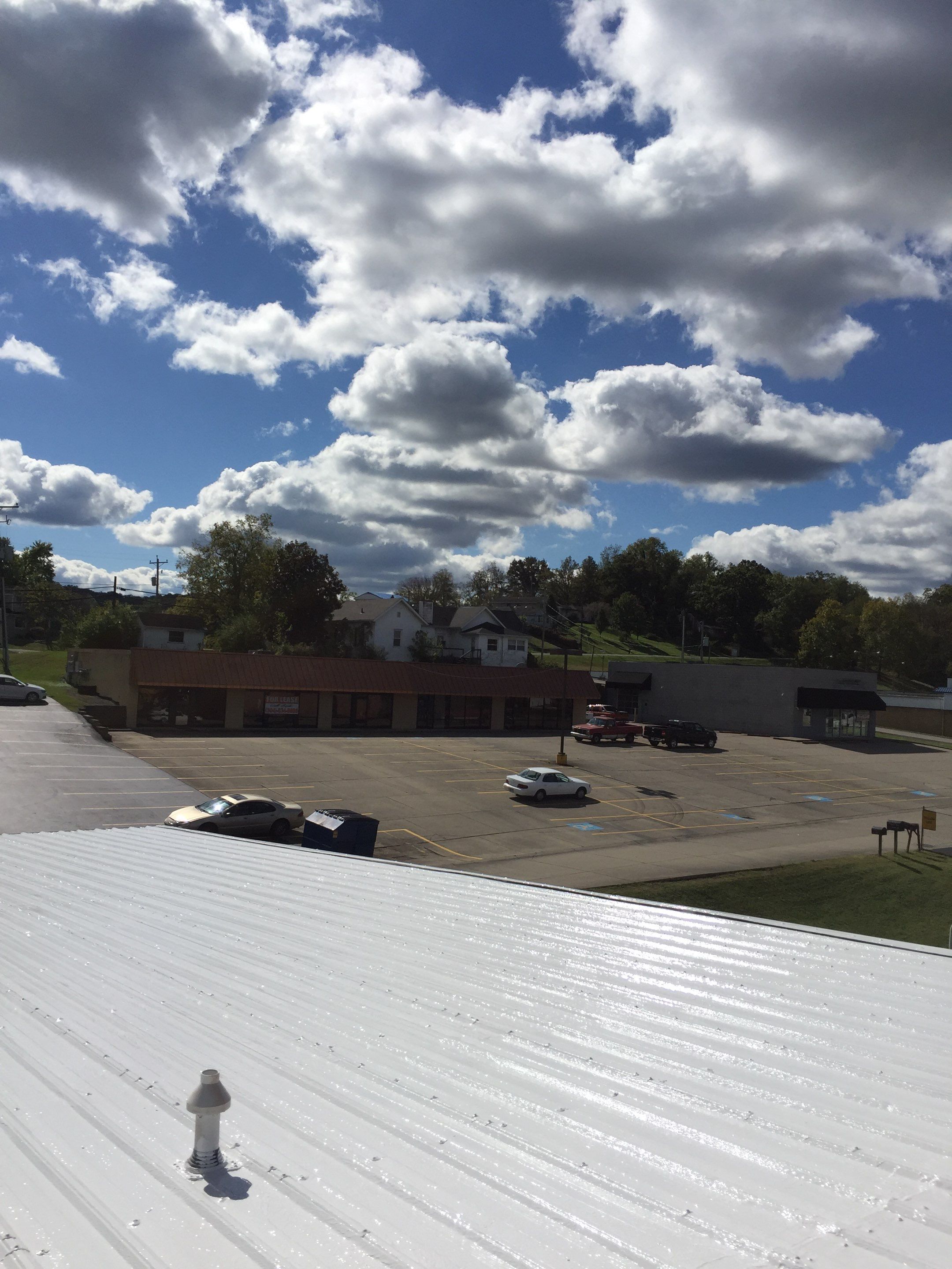Commercial Roof Coating using Gaco Silicone Roof Coating by Secure Construction Company Inc