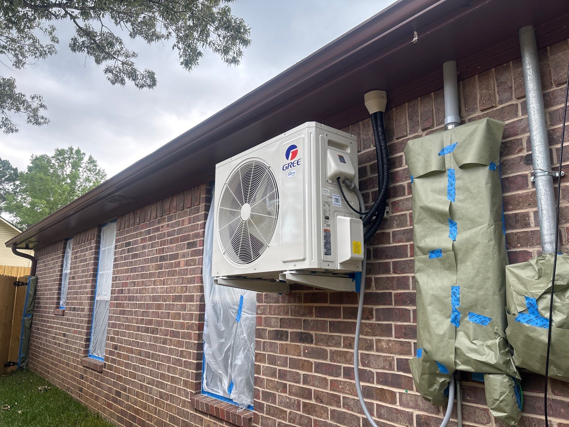 Project in TylerExterior Painting in Tyler, TX | White Brick Home, Varnished Fence & Shed Painting by Quality Coats Painting