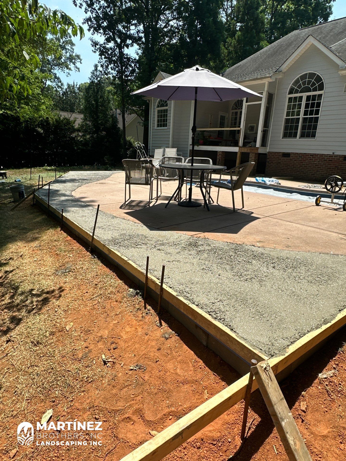 Cool decking pool in Youngsville by Martinez Brother’s Nc Landscaping Inc