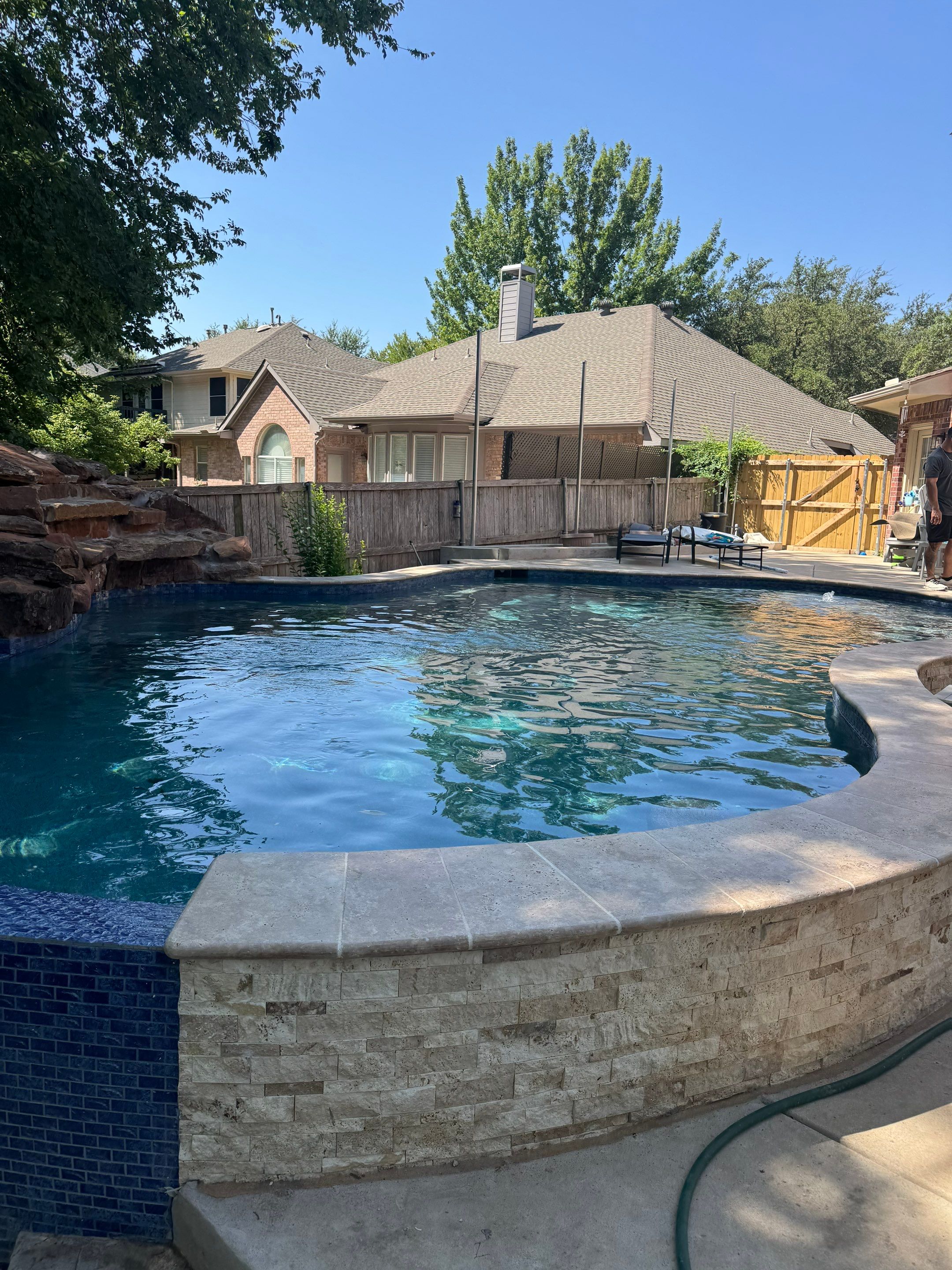 Freeform Pool with Rock Waterfall and Raised Spa by Pinnacle Pools and Spas - DFW