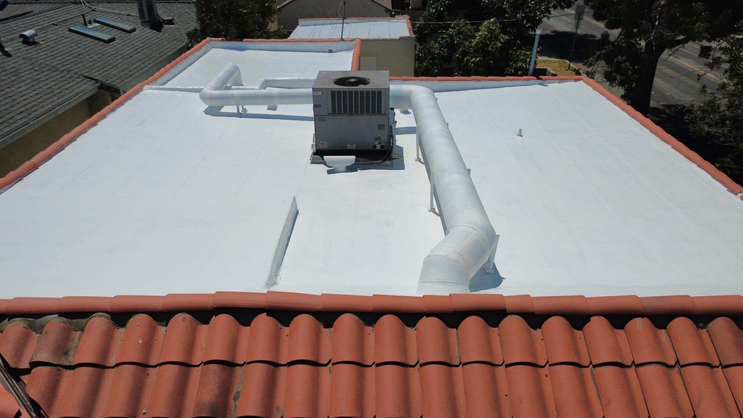 Tile Reset and Silicone Membrane Installation by Hull Brothers Roofing