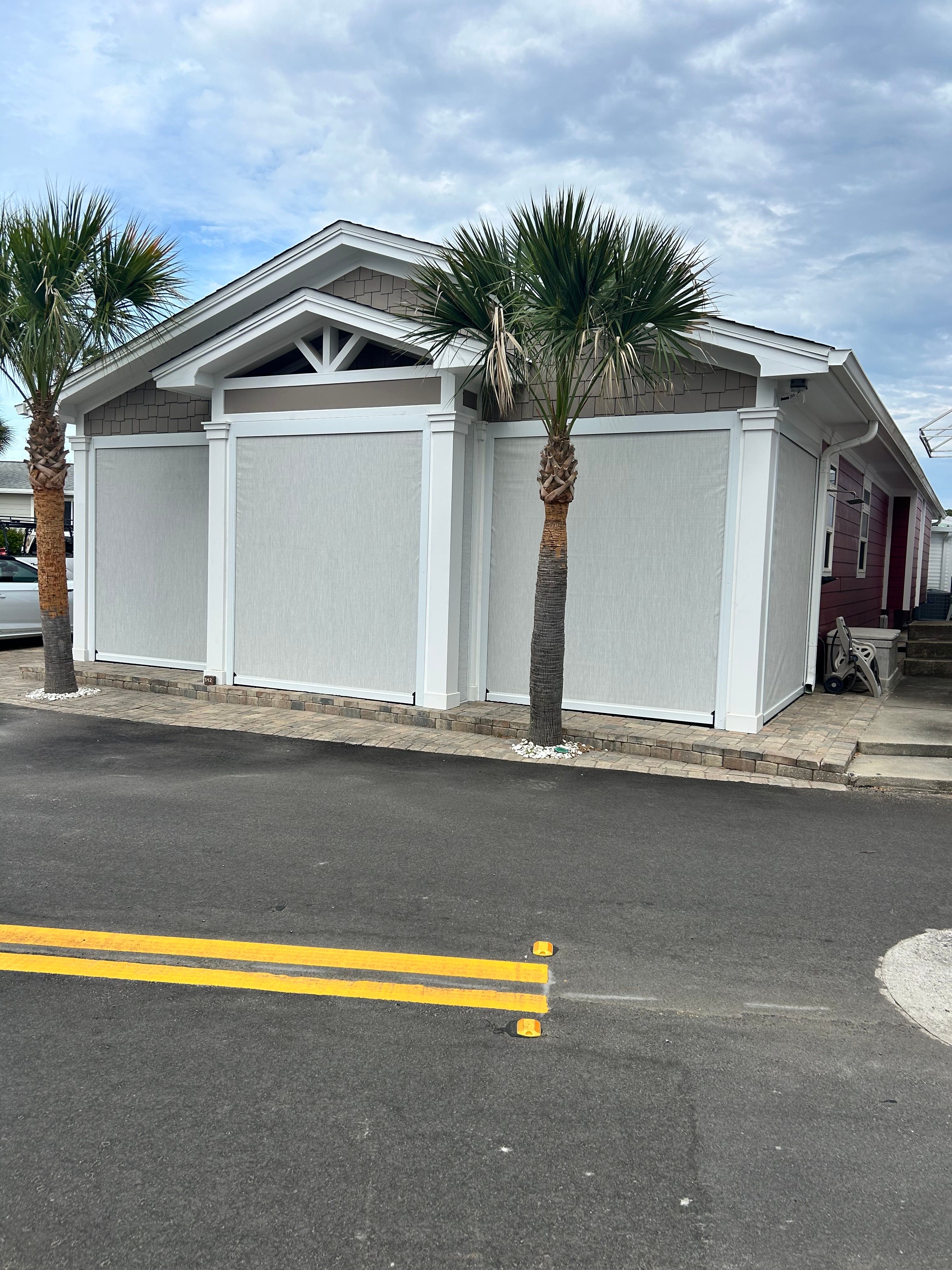 Fenetex Motorized Screen and Hurricane Shutter Installation in Panama City Beach by Brannan Aluminum Inc.