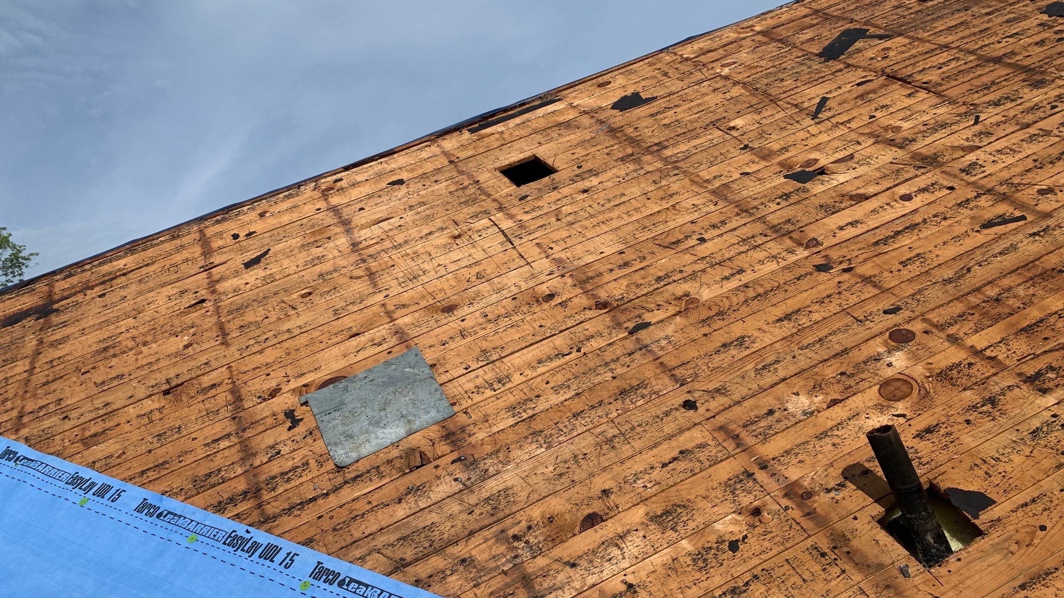 Residential Roofing Installation using 50 mil PVC by Hostetler Roofing
