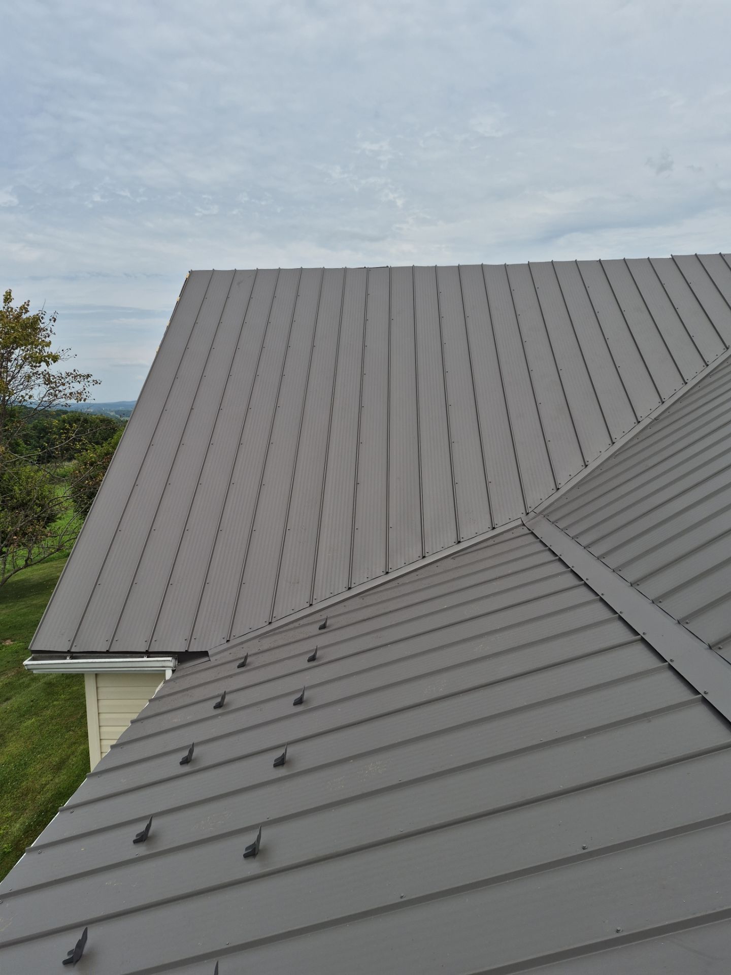 Newport Metal Roof Replacement with New Skylights by Esh Builders