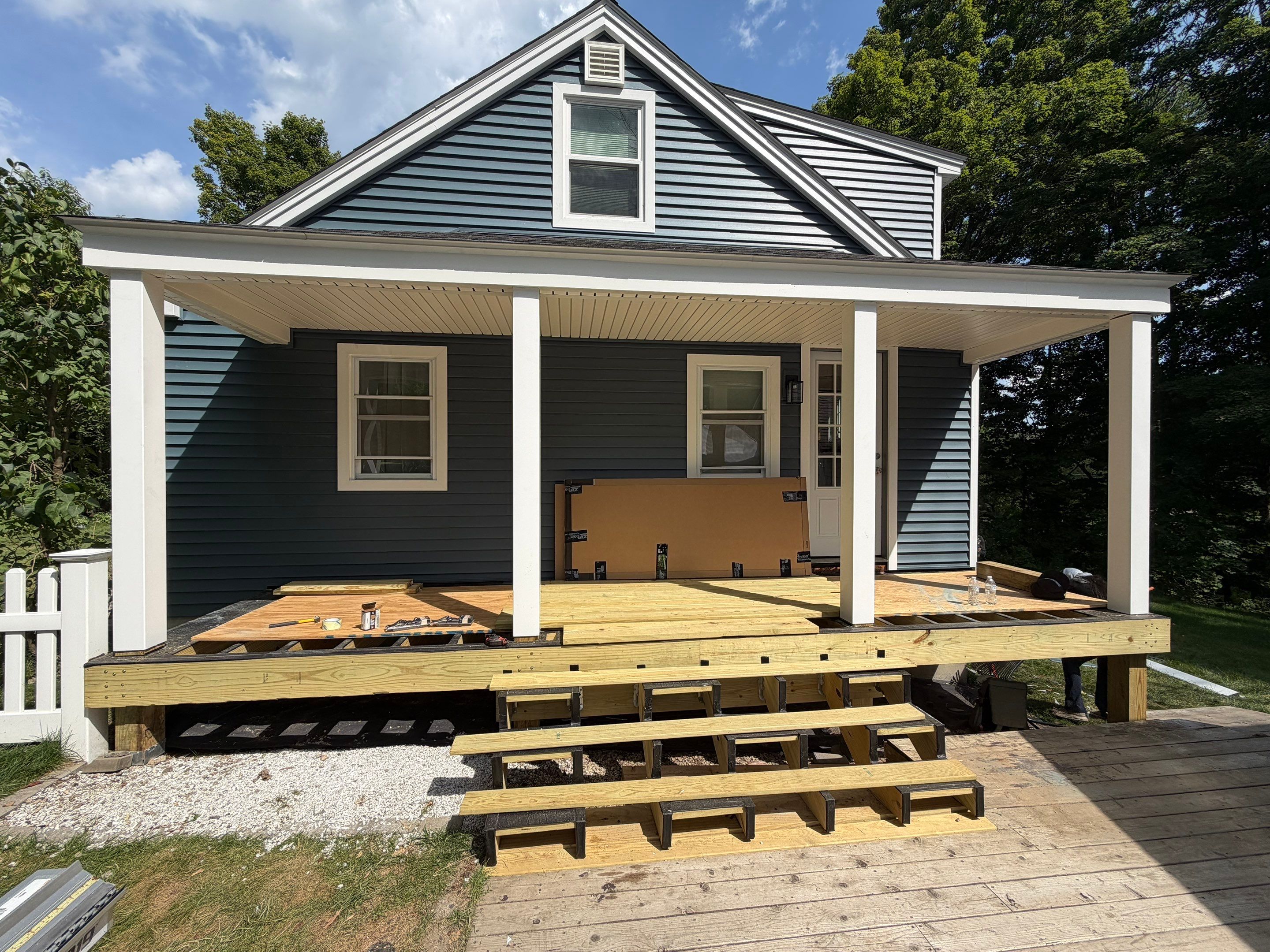 Complete Exterior Renovation Featuring Owens Corning Shingles and Vinyl Siding by Tall pine roofing