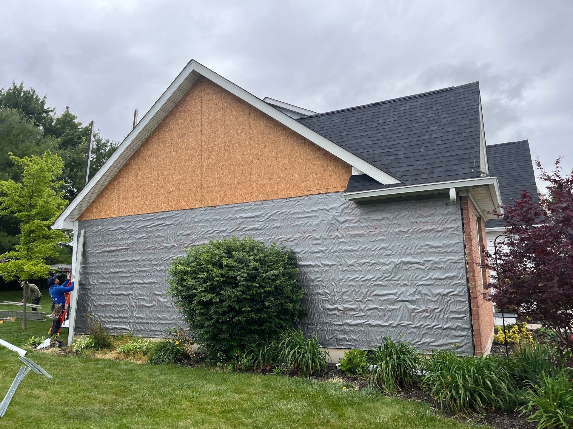 Exterior Installation using Onyx Black Durations and White Siding by WIW Enterprises Inc