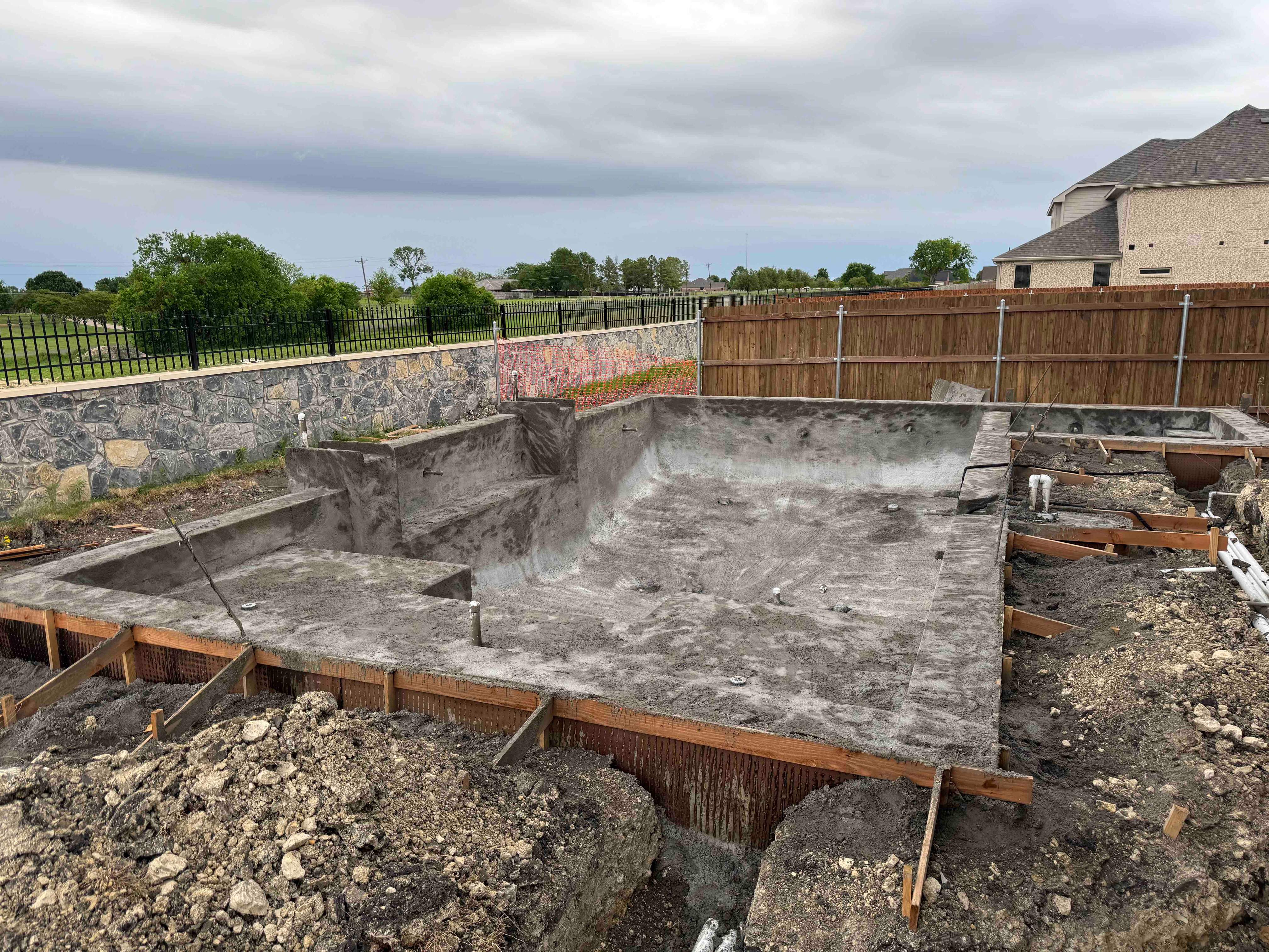 Geometric Pool with Tanning Ledge and Turf Accents by Pinnacle Pools and Spas - DFW