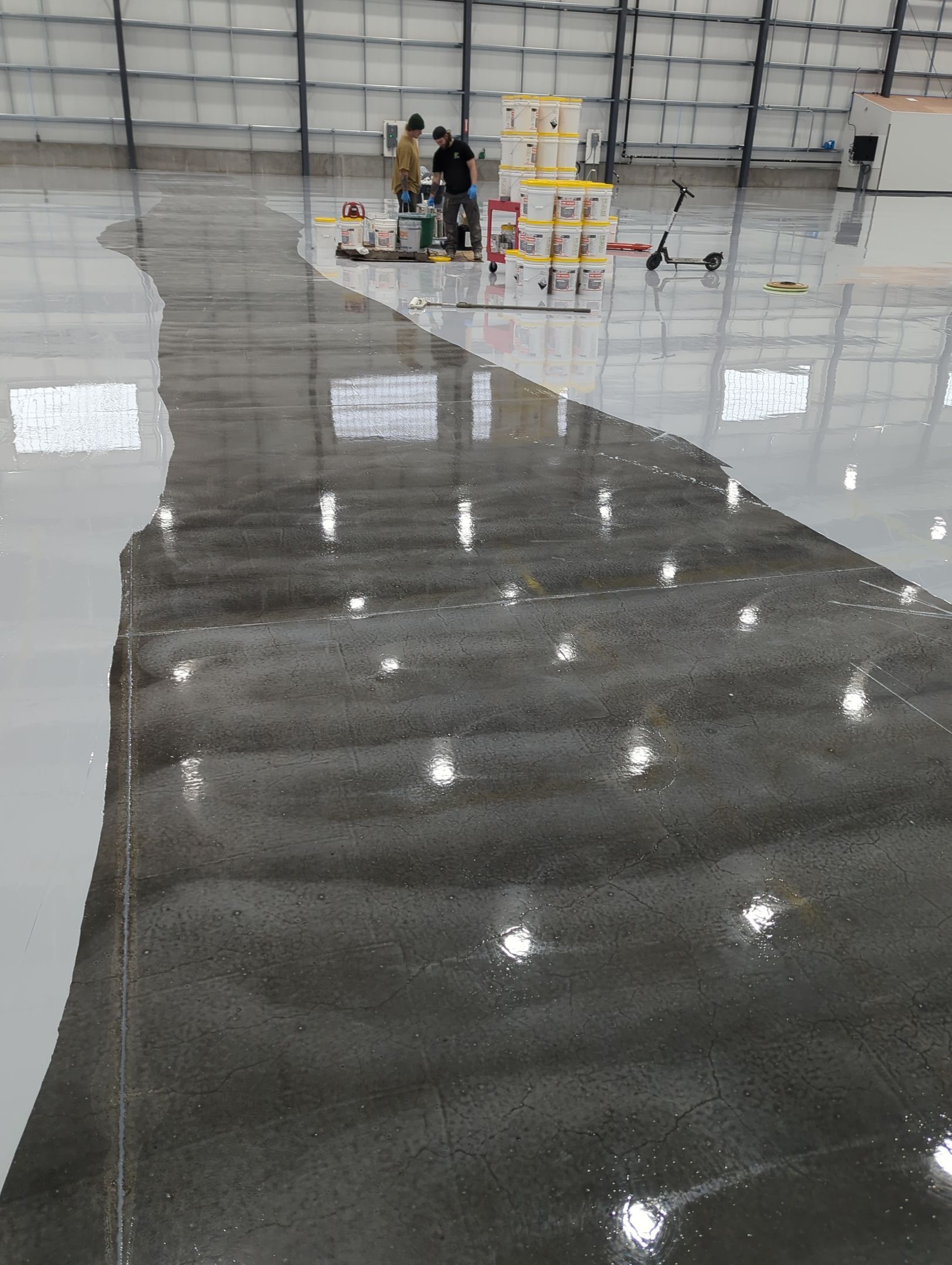 Airplane Hanger using Light Grey Commercial Penntek Epoxy by Croc Coatings, LLC