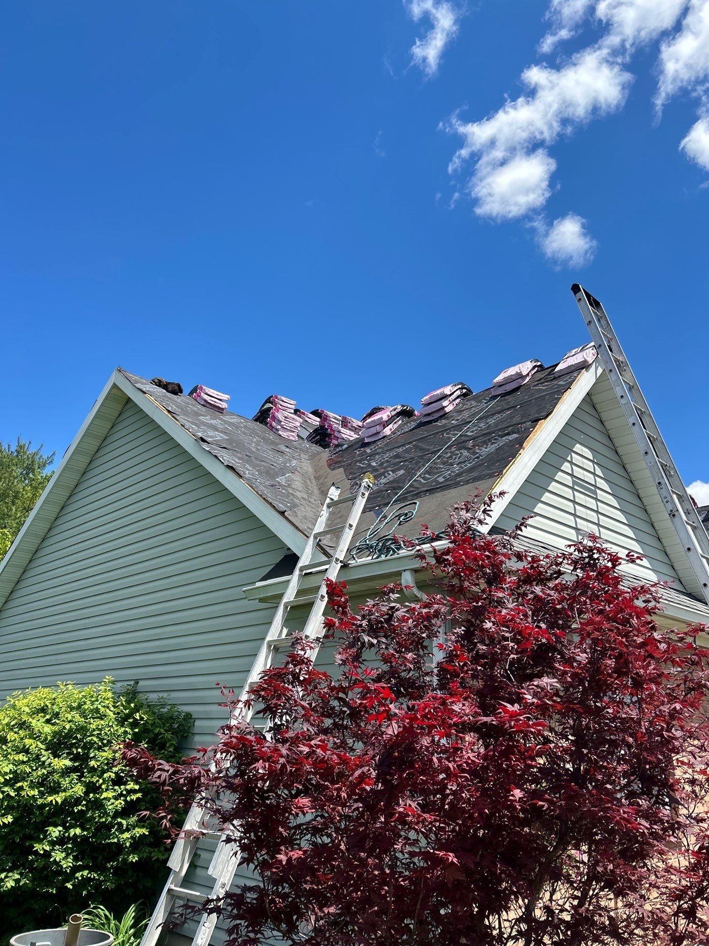 Exterior Installation using Onyx Black Durations and White Siding by WIW Enterprises Inc