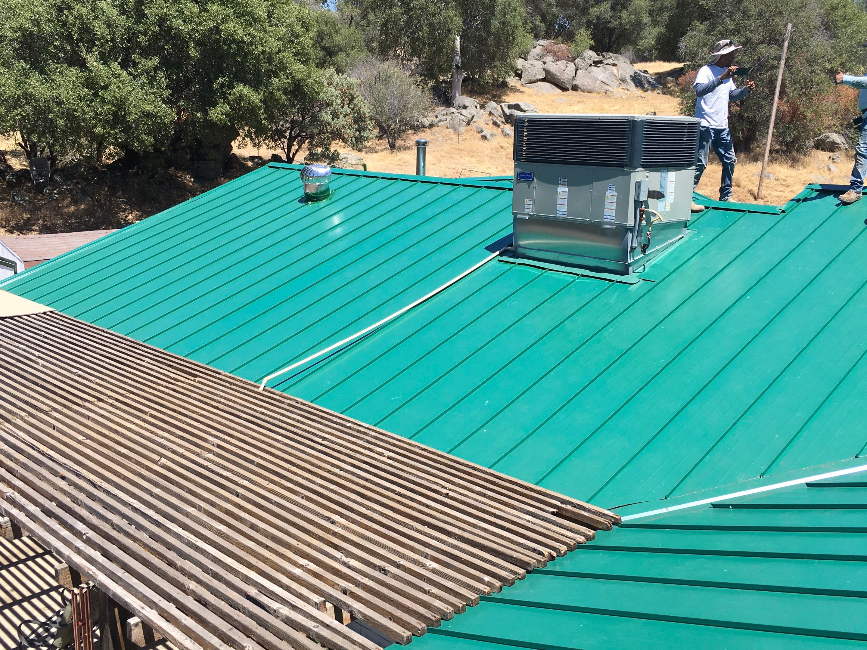 Metal roofing installation using Standing seam metal roofing system by Straight Edge Roofing Inc