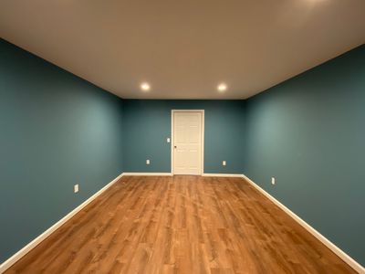 Finished Basement Transformation With Luxury Vinyl Plank Flooring in Acworth