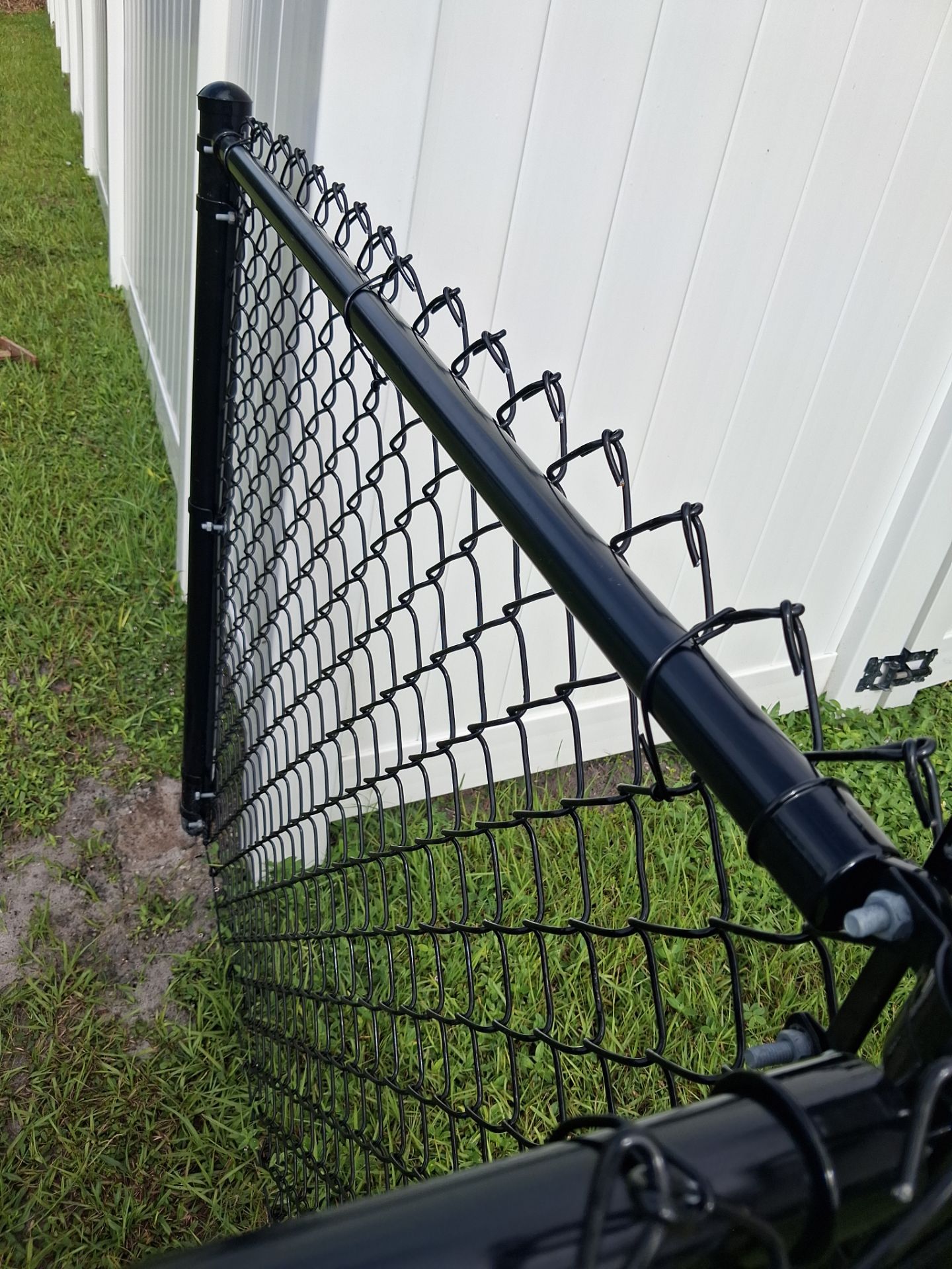 Black Chain Link Perimeter Fencing for North Port Residential Property by True Fence LLC