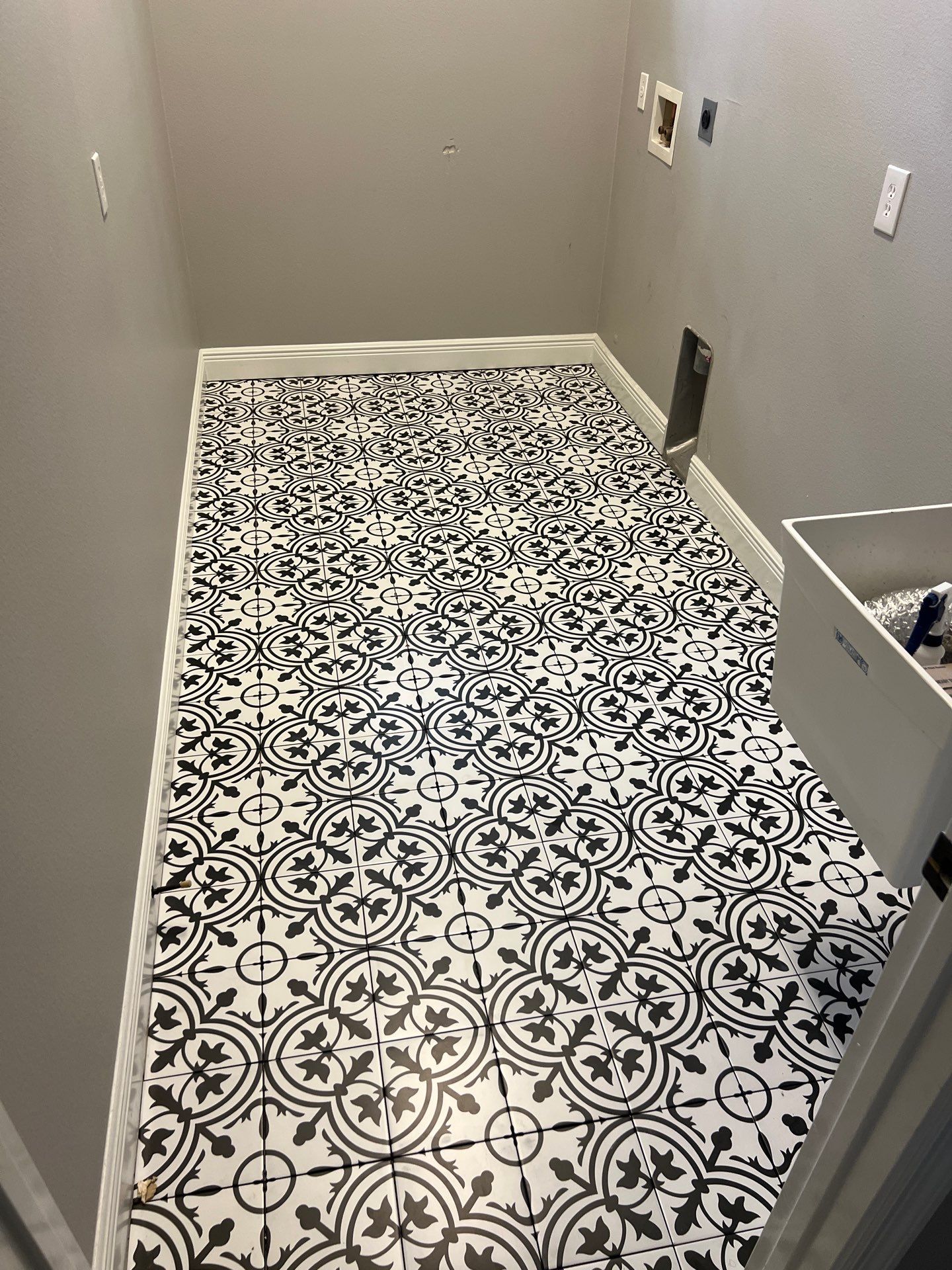 Laundry tile upgrade by Vrmmm Flooring