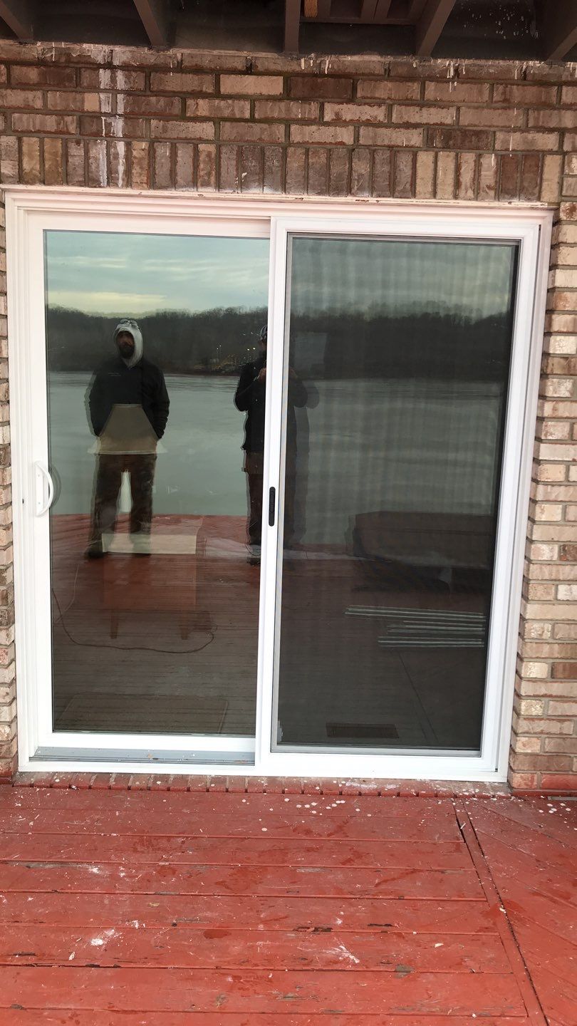 Deck Refurbush and Door Replacement using Trex Decking and Railing. Polaris Patio Doors by Secure Construction Company Inc