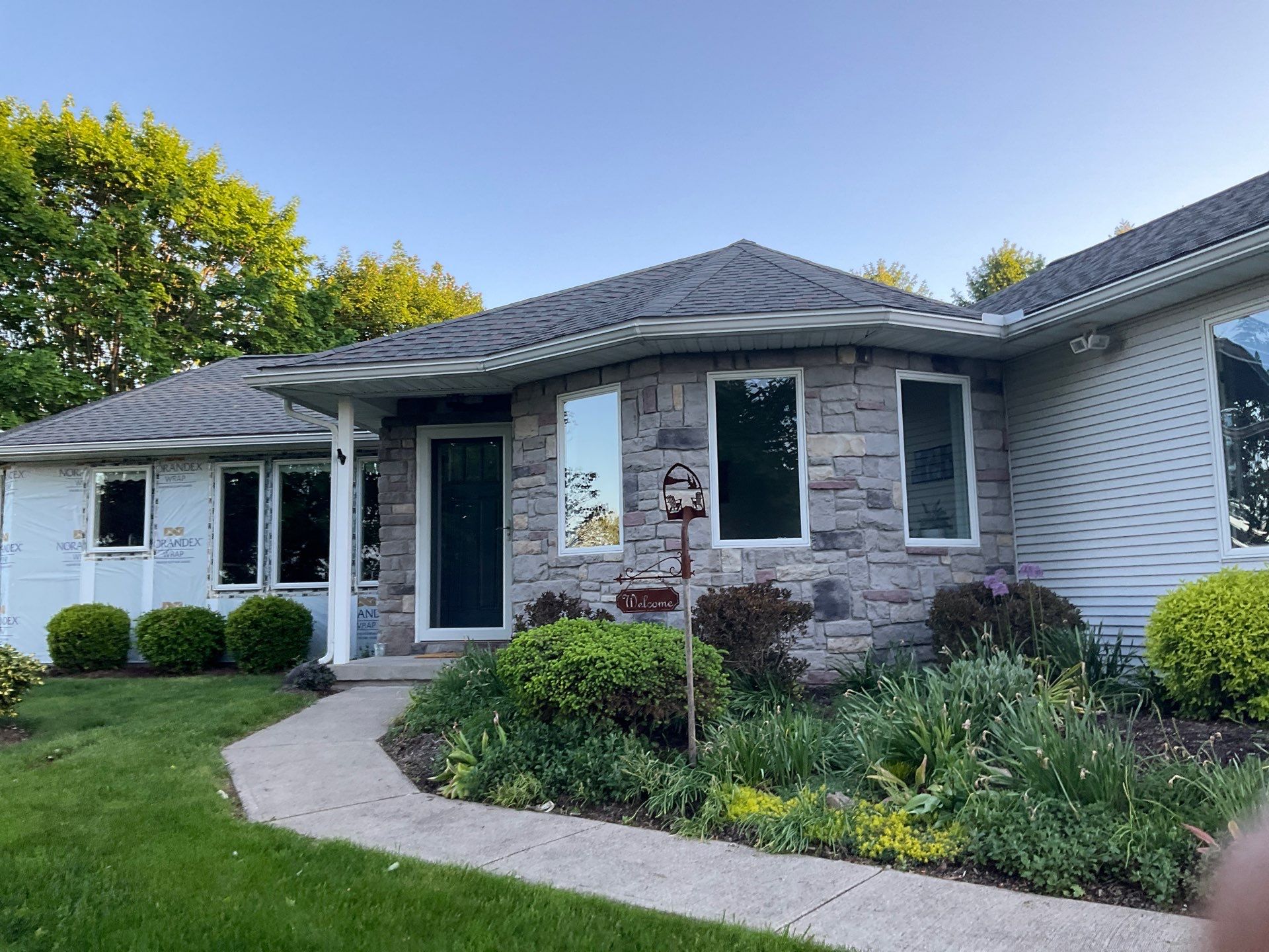 Nightfall Exterior Siding Replacement and Stone Veneer in Halifax by Esh Builders