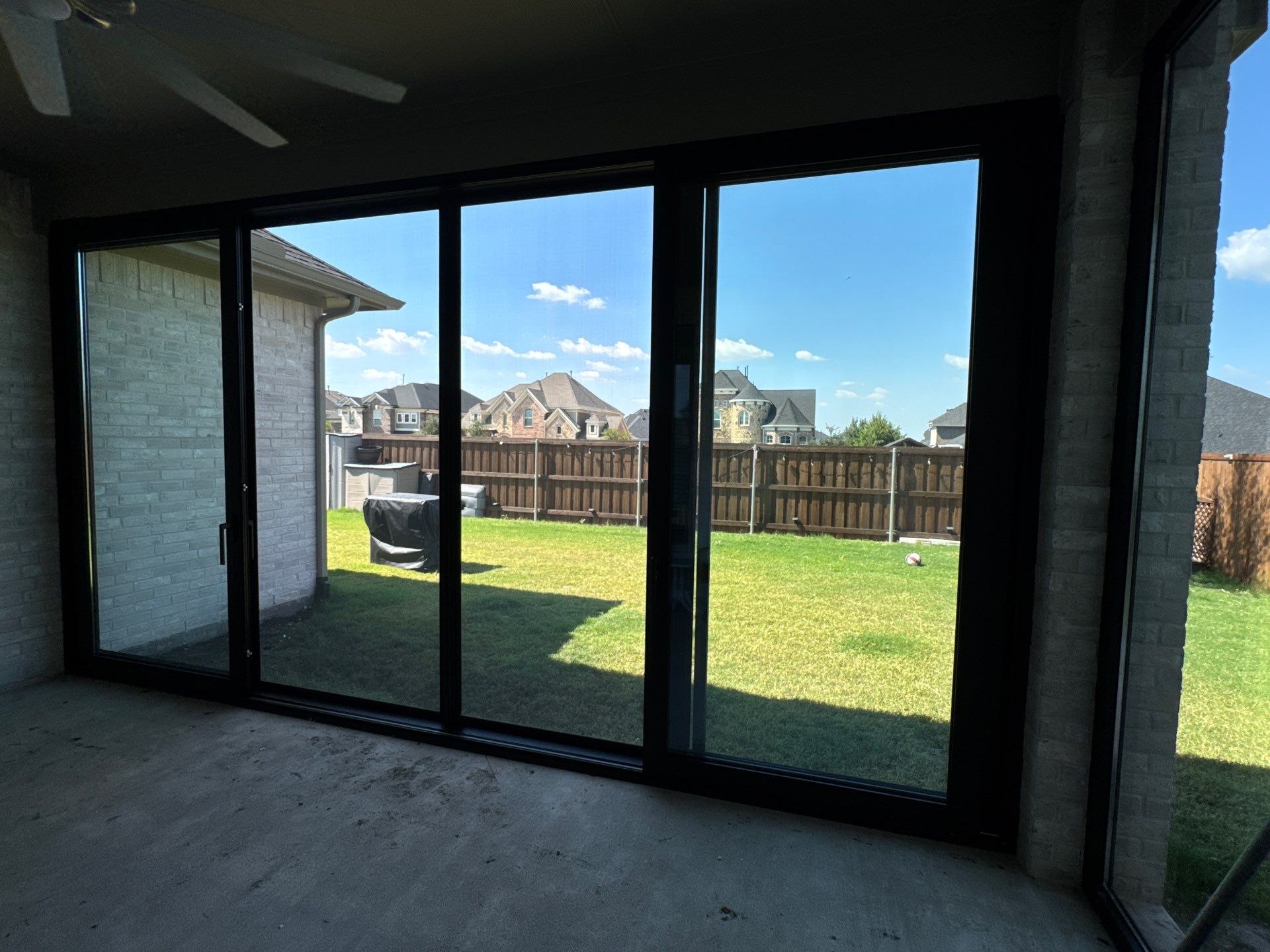 Year-Round Bonus Room: Patio Enclosure Featuring 16ft Seamless Sliding Glass by Tibi Soli LLC