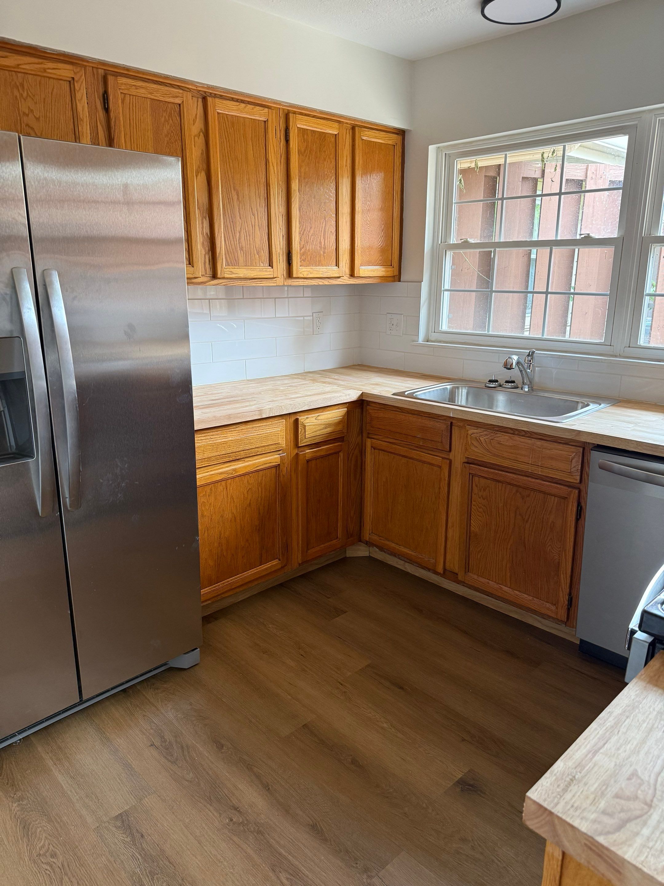 Complete Home Remodel Featuring Custom Kitchen and Wood-Look Plank Flooring by MAJO