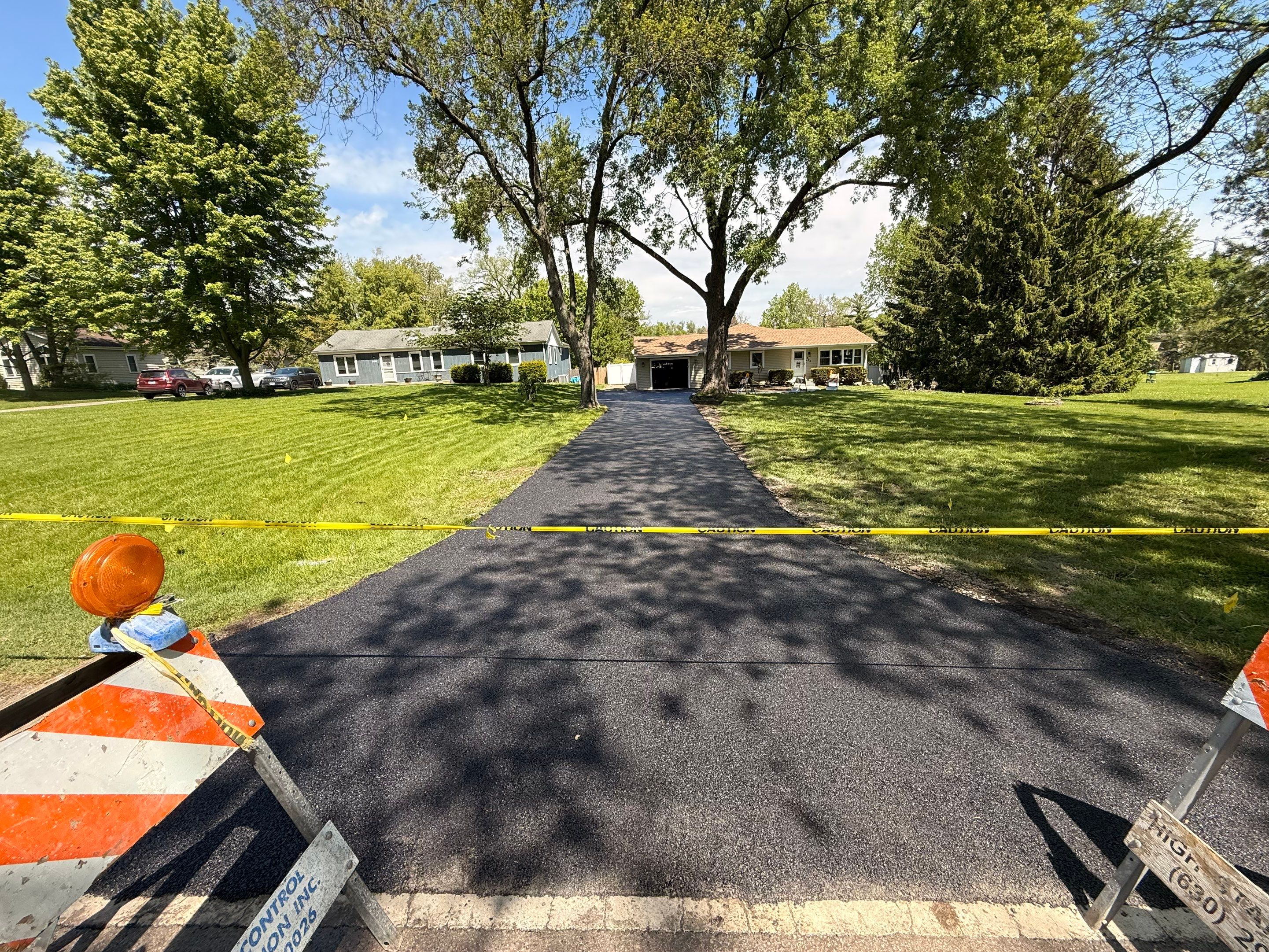 full asphalt driveway replacement by PaveRight Concrete&Asphalt LLC