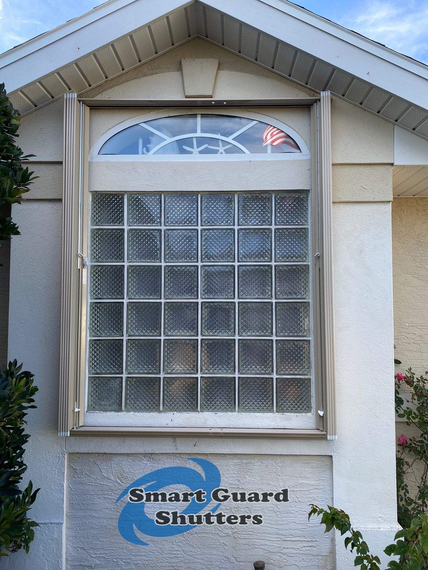 Accordion Shutters in Beige by Smart Guard Shutters