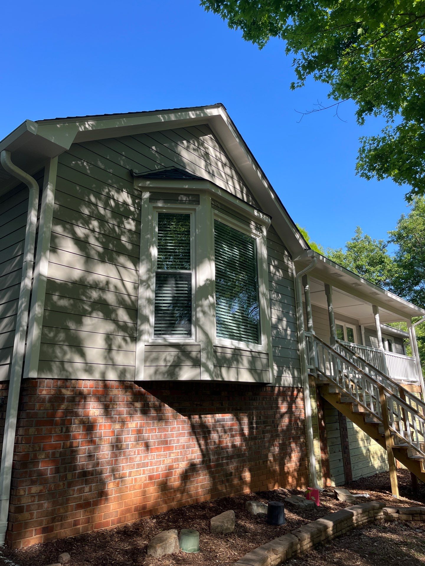Window, Siding, & Rotten Wood Replacement with Exterior Painting in Woodstock, GA by Nelson Exteriors 