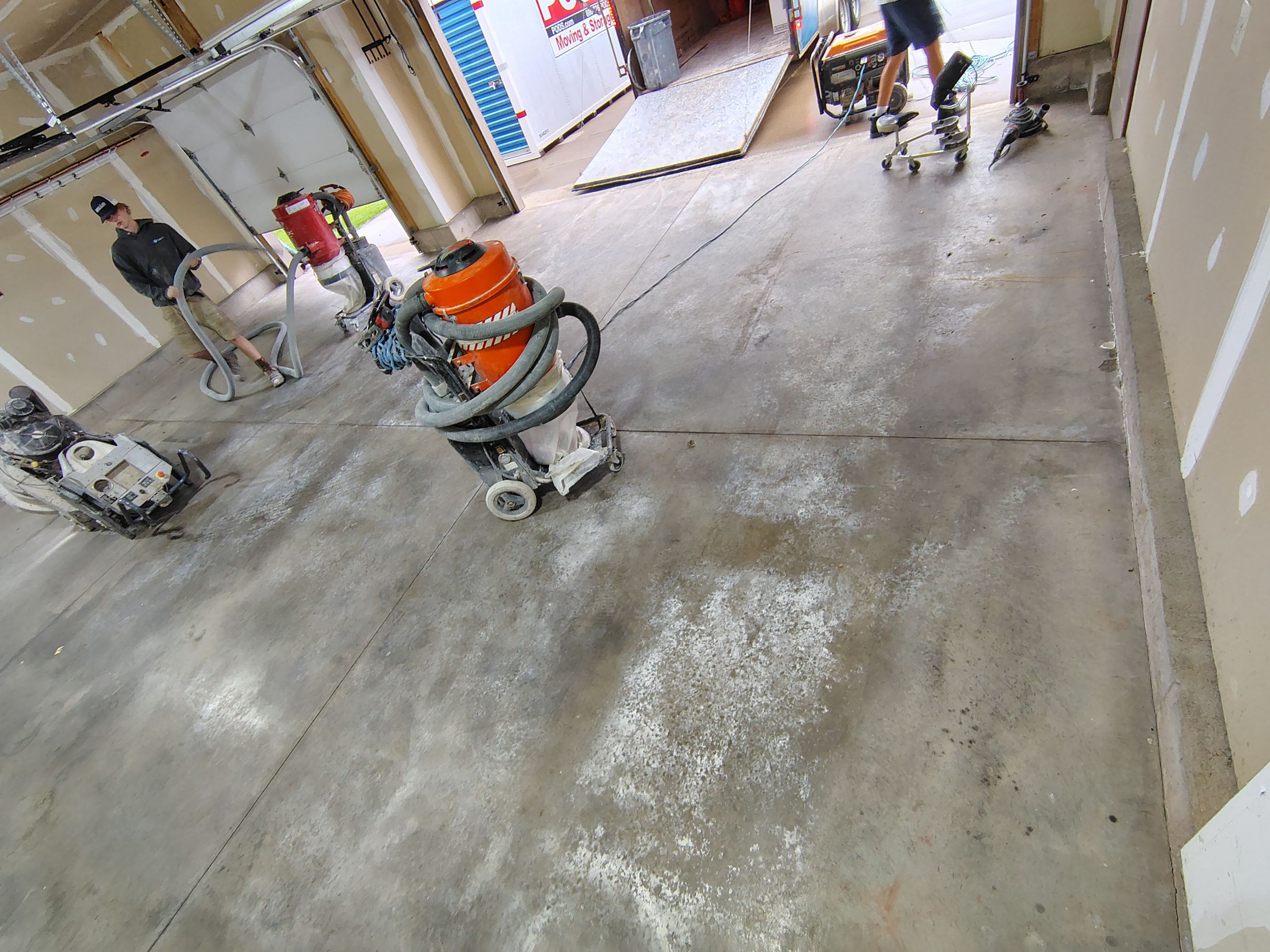 Multi-Car Garage Concrete Coating and Epoxy Finish in Sioux Falls by Select Painting, Coatings & Garage Cabinets