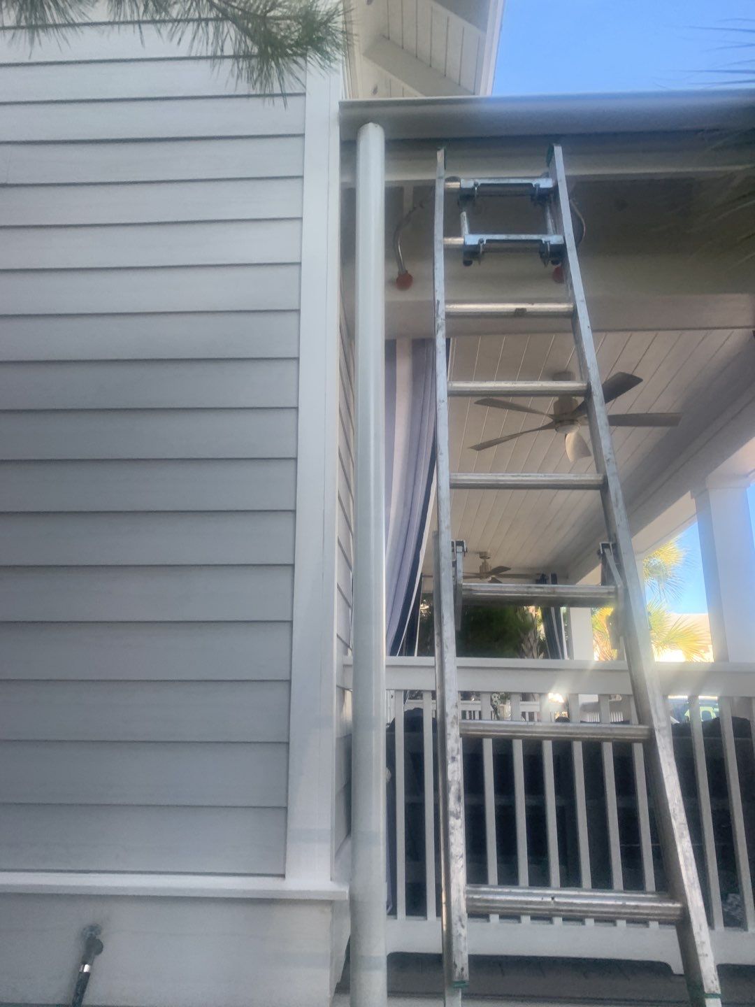 White Half-Round Gutters Installation in Rosemary Beach, FL by Gutter Professors
