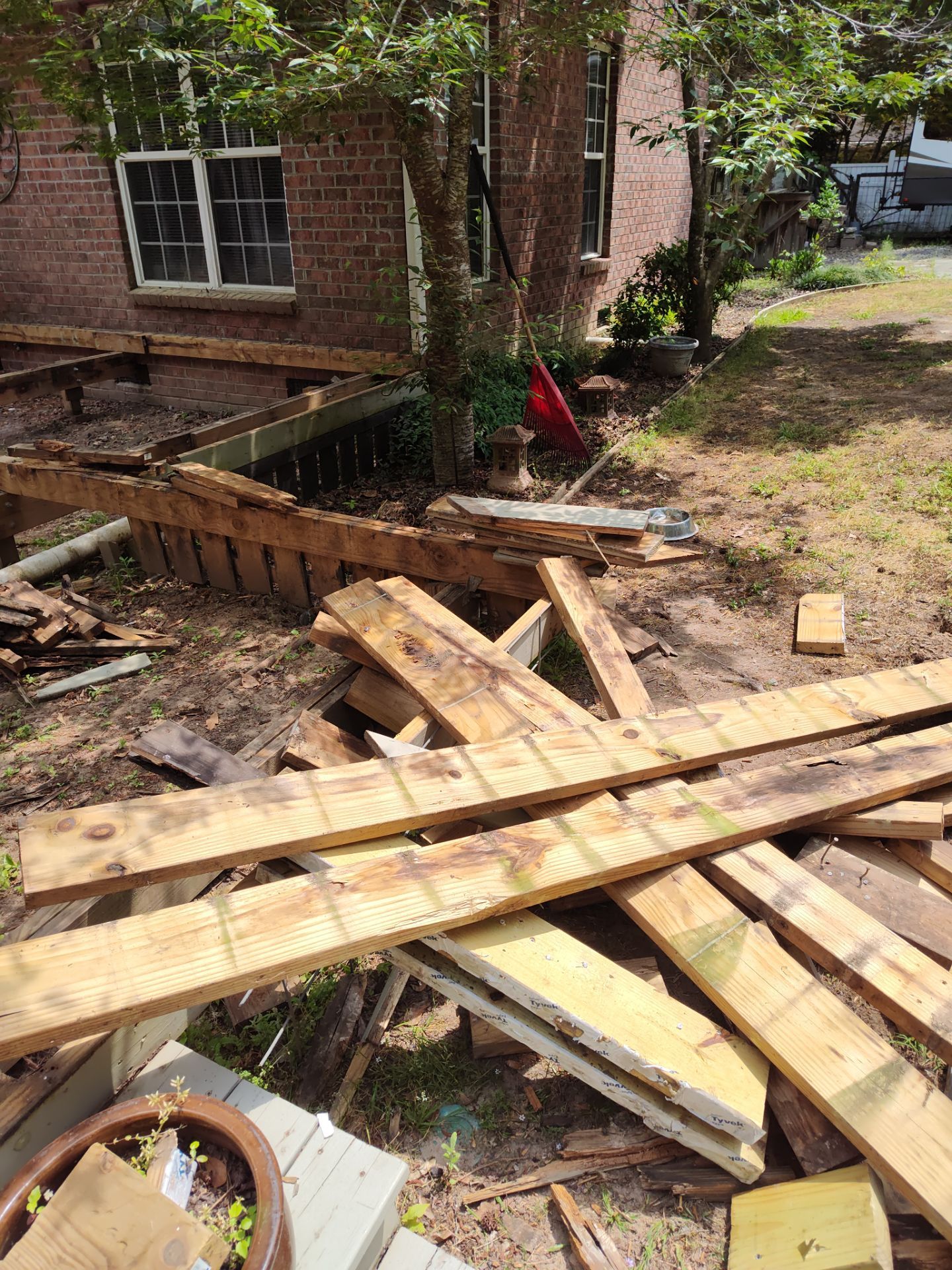Patio in concrete with drainage improvements by Cornerstone Home Builders, LLC