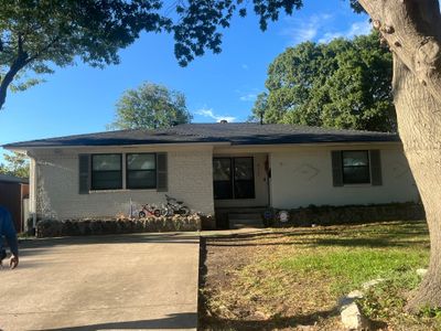 White brick/light gray shutters with IKO Granite Black 