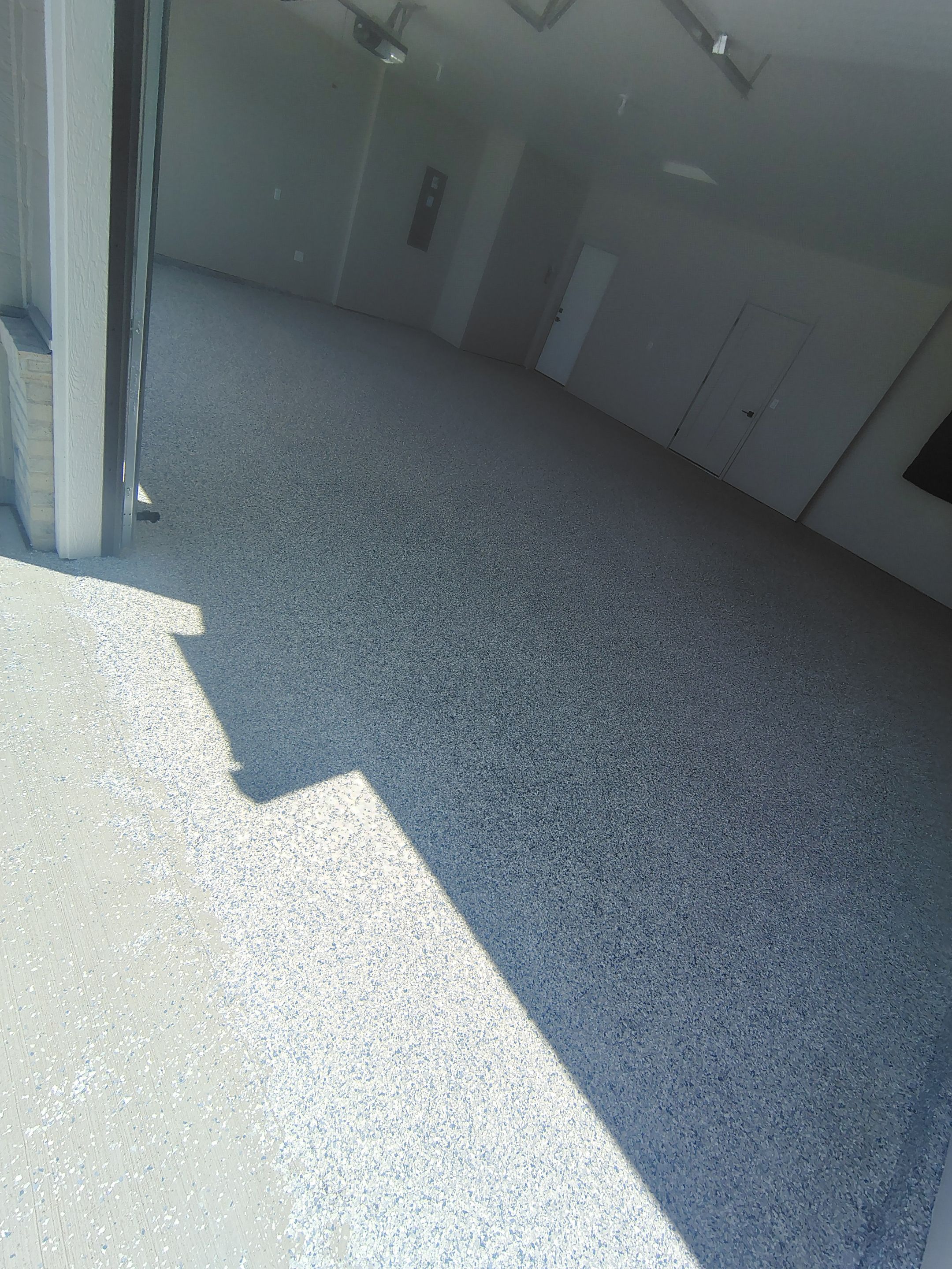 Full Speckled Concrete Coating for Sioux Falls Garage by Select Painting, Coatings & Garage Cabinets
