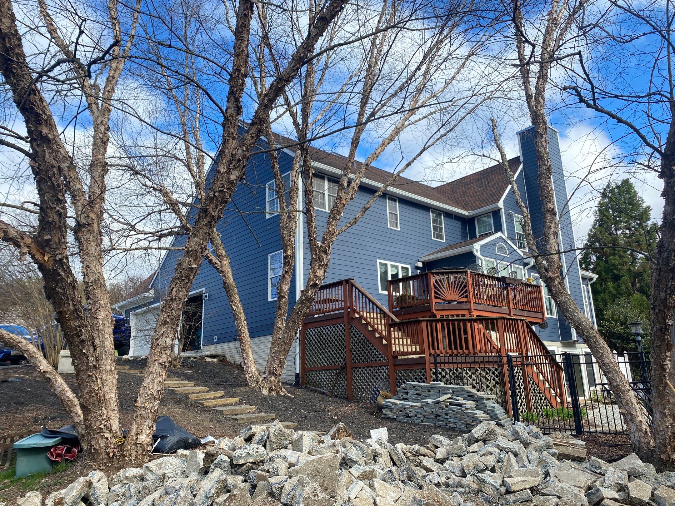 James Hardie Plank Siding + Seamless Gutters by American Home Contractors