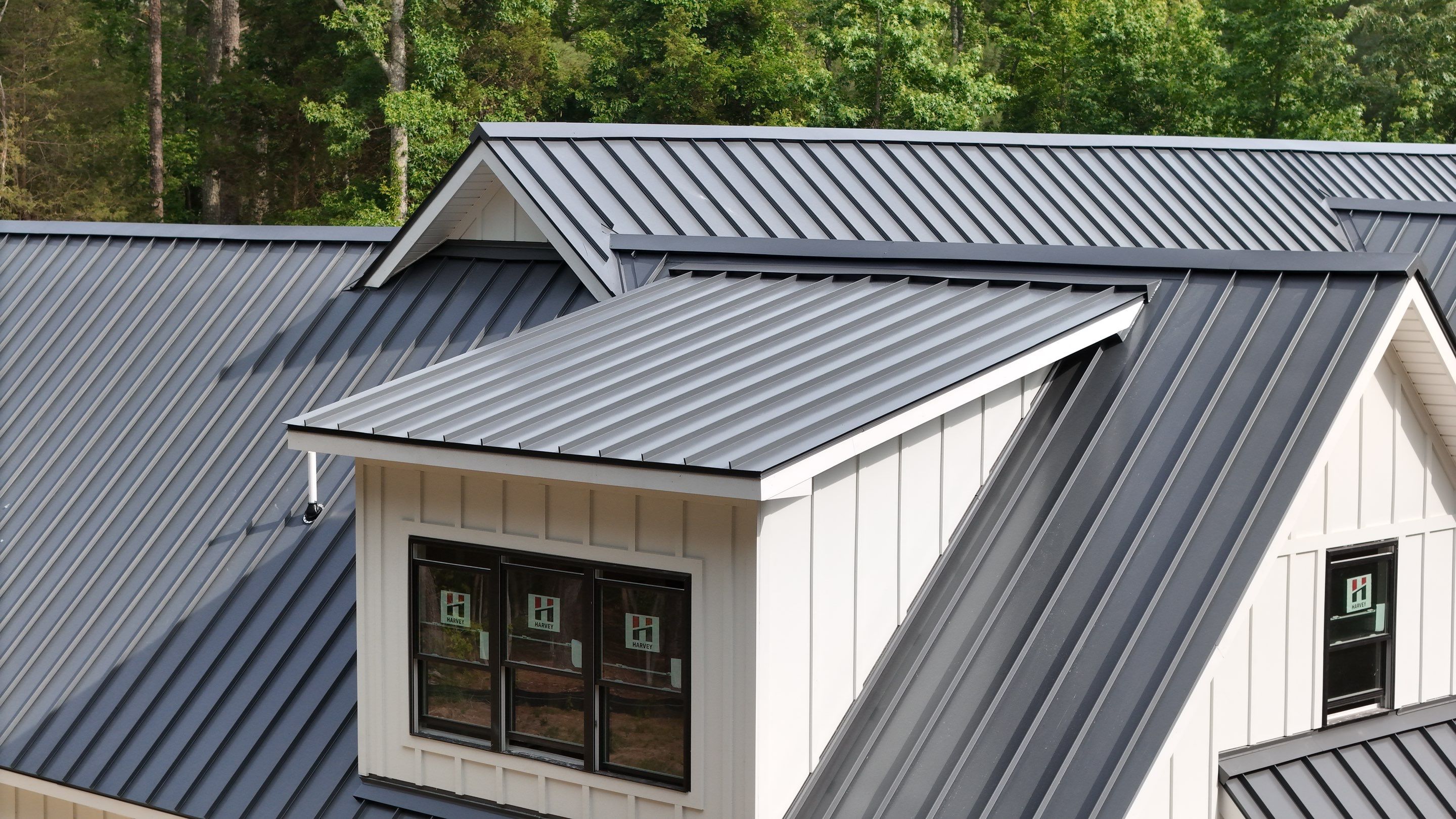 Custom New Construction Home Featuring Standing Seam Metal Roofing in Port Haywood by Cade Construction