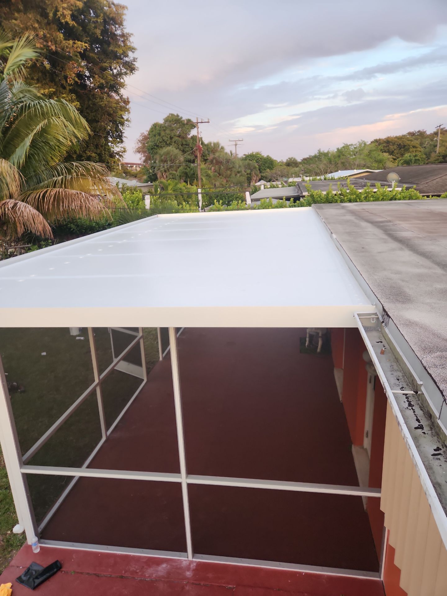 Insulated Screen Enclosure and Wood Tile Deck Installation in Plantation by Aastro Roofing