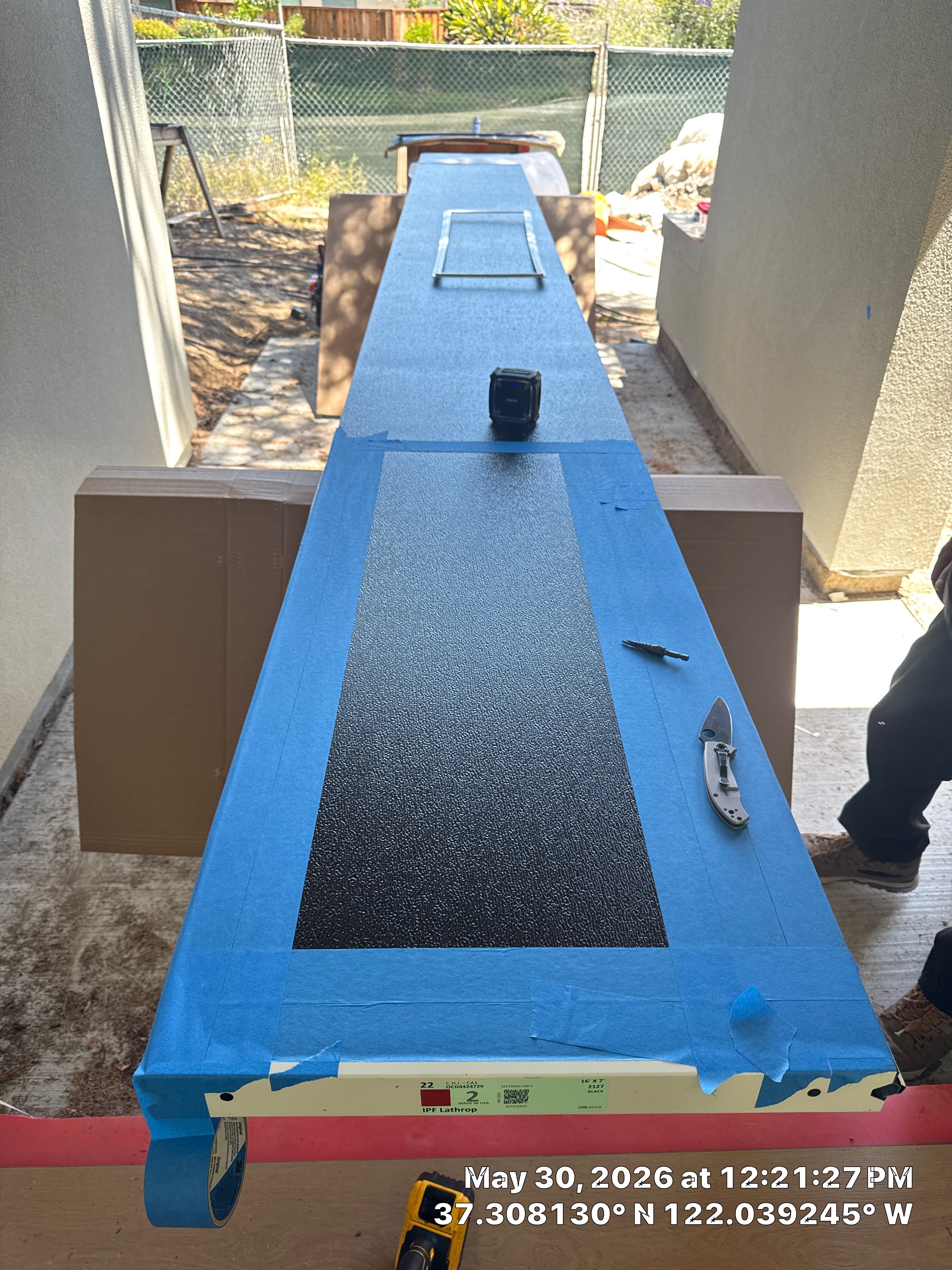 Modern Black Garage Door Installation With Vertical Windows In Cupertino by Valiant Garage Door