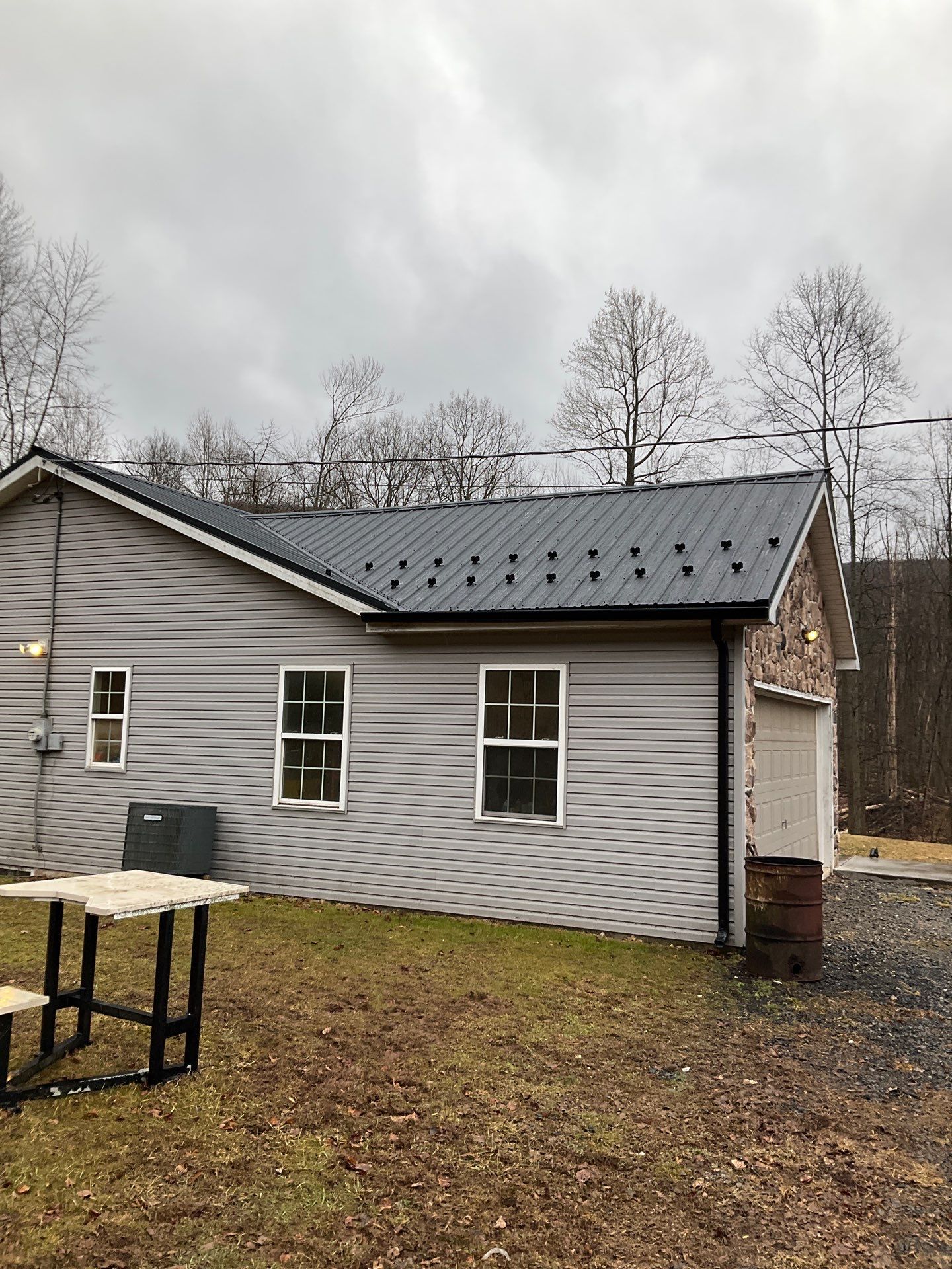 Black Metal Roof Replacement and Gutter Installation in Halifax by Esh Builders