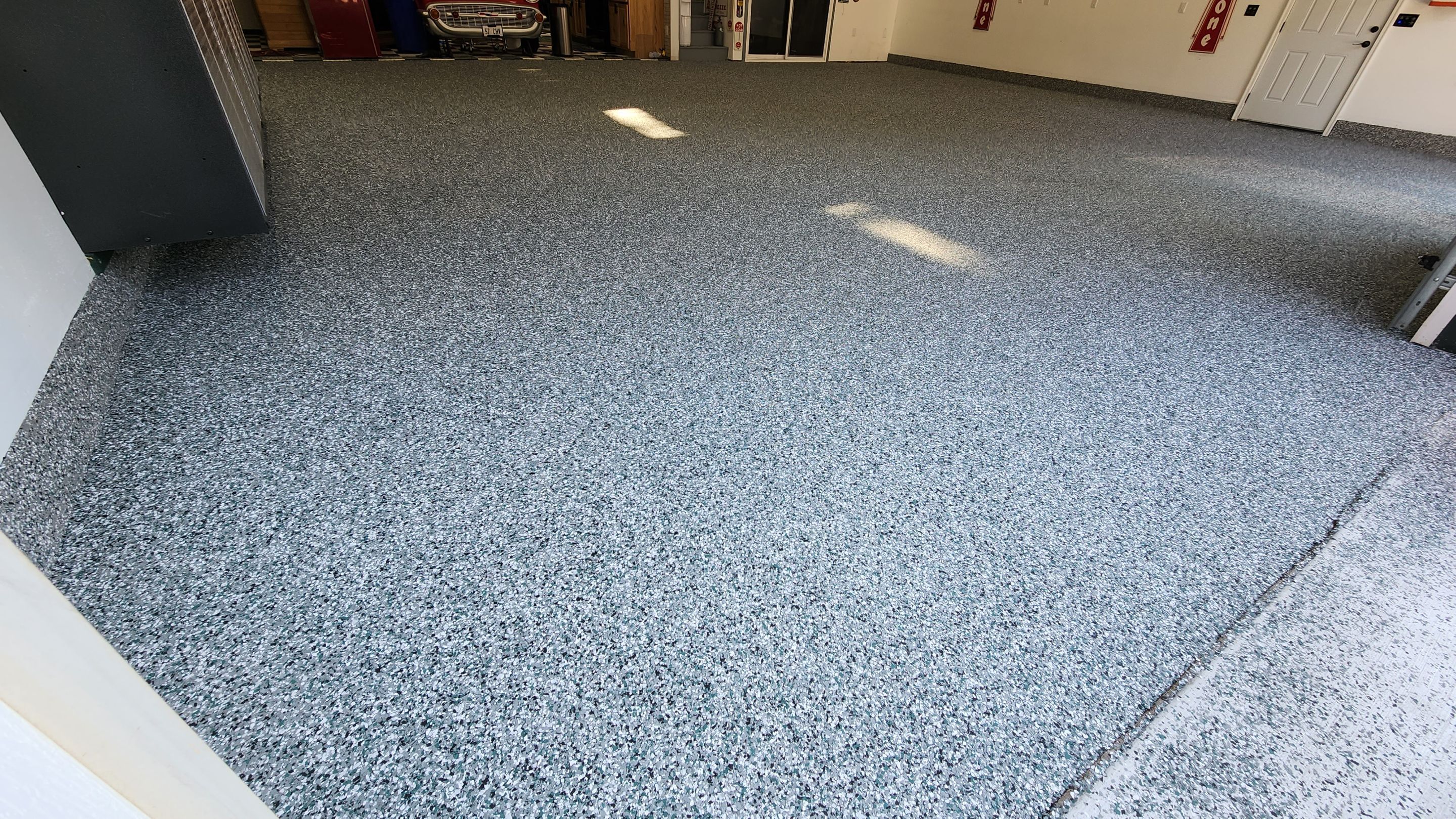 Garage Transformation using Domino with Blue by Croc Coatings, LLC