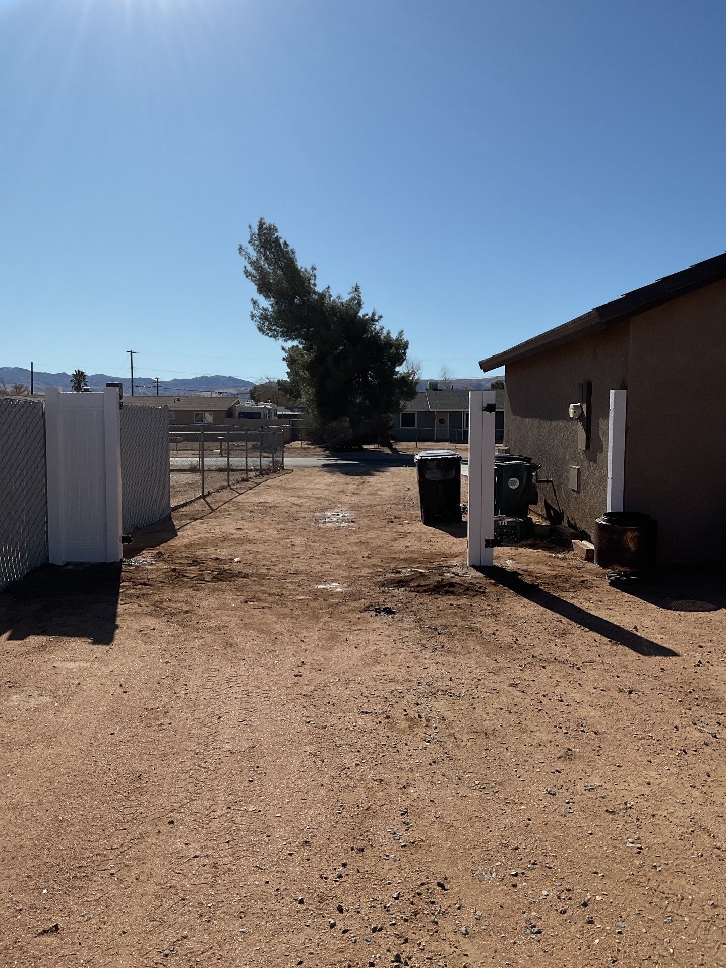 Gate installation using Vinyl by Fence Guys Inc. 