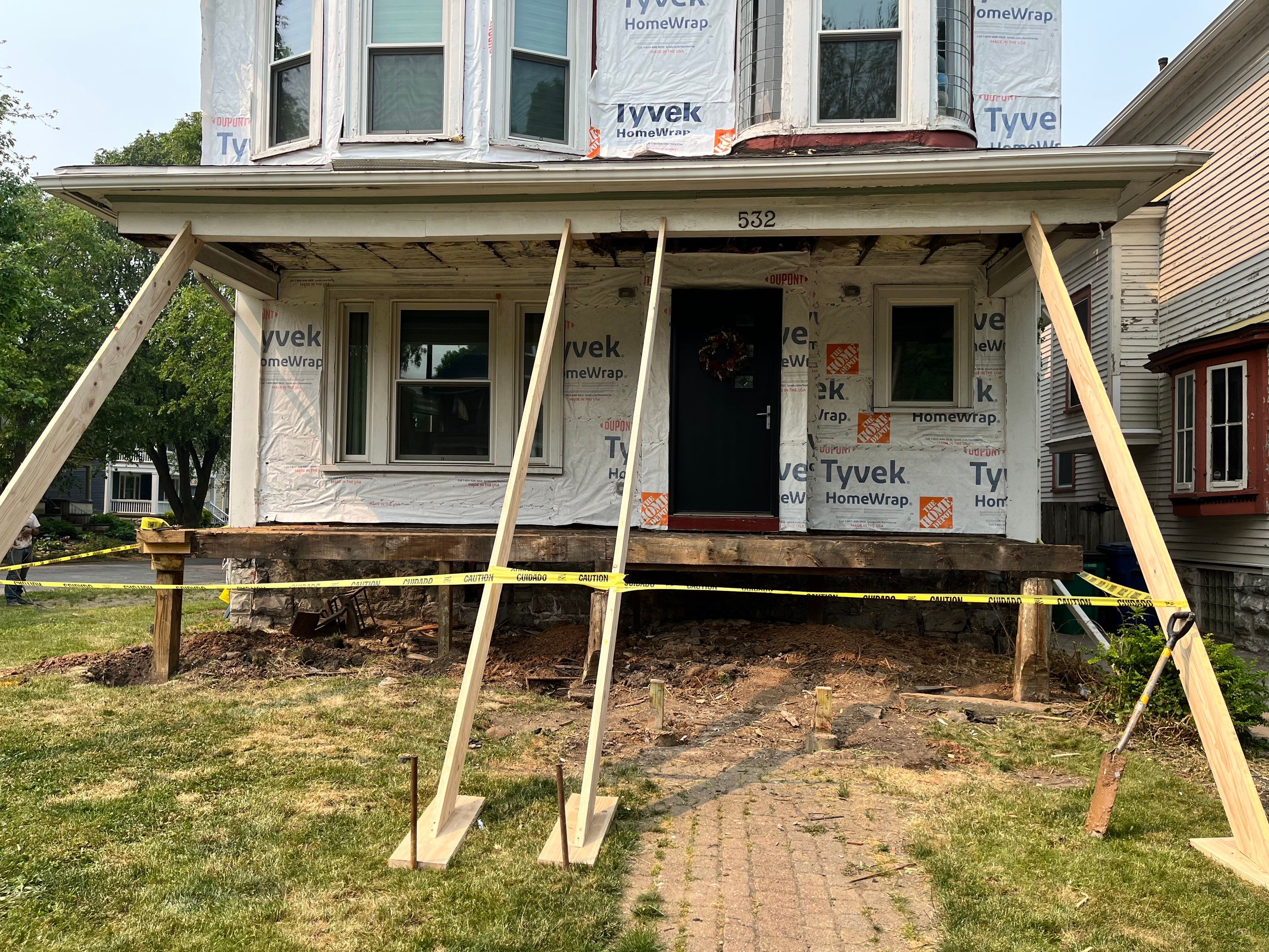 Exterior Renovations- Siding, Stamped Concrete, Porch, and Railings by Ivy Lea Construction