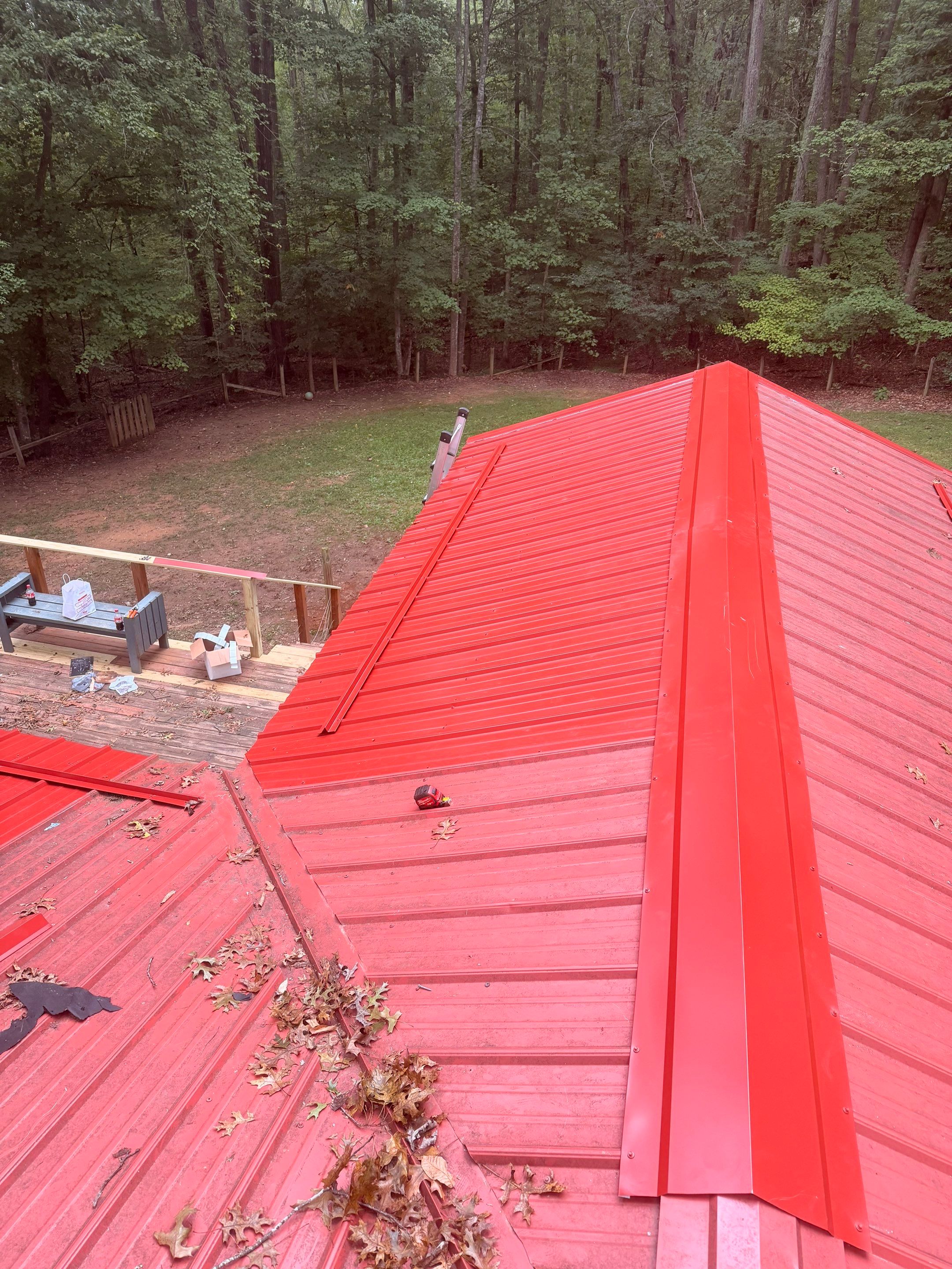 Red Metal Roof Restoration and Wood Fascia Replacement in Barboursville by Cade Construction