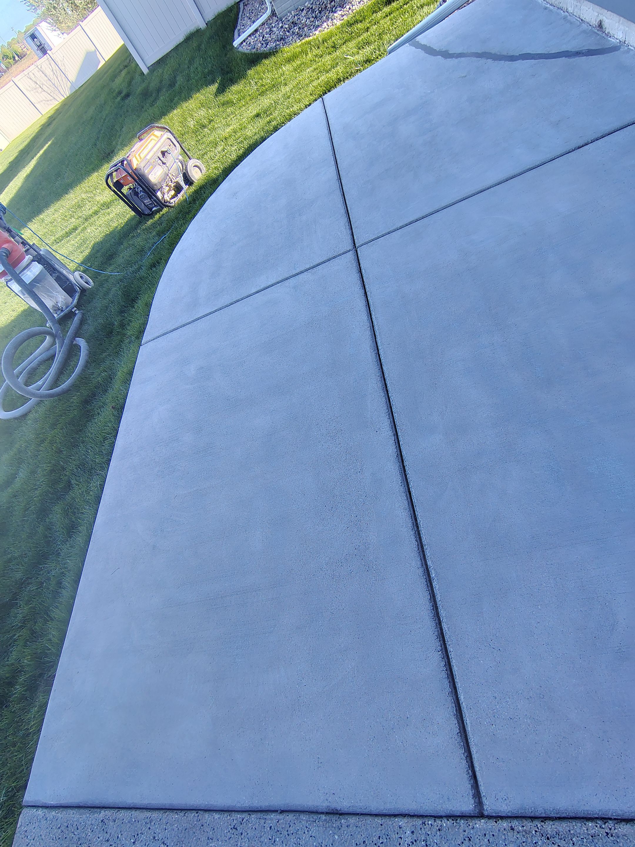 Speckled Concrete Patio Coating Installation in Sioux Falls by Select Painting, Coatings & Garage Cabinets
